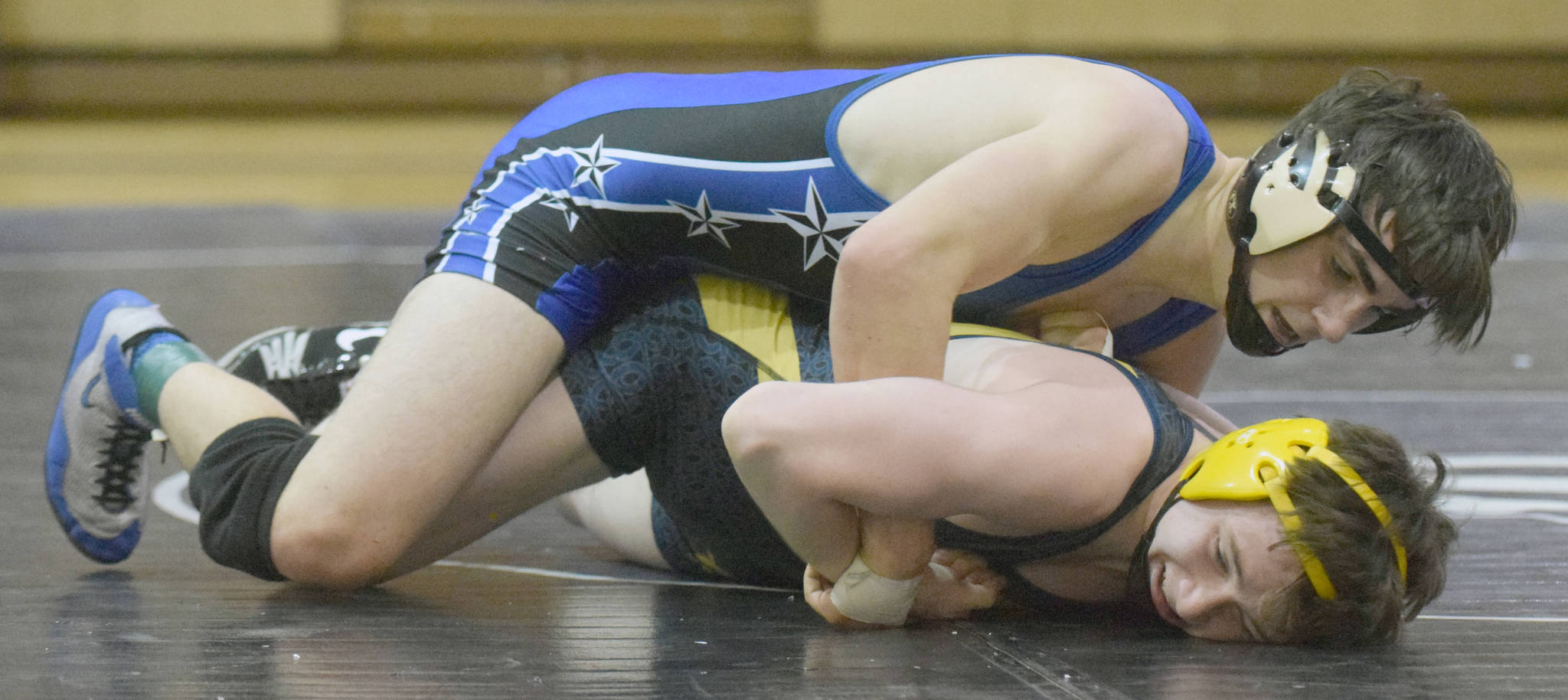 Soldotna’s Gideon Hutchison works his way to a pin of Homer’s Ian Stovall on Tuesday, Nov. 27, 2018, at Soldotna Prep. (Photo by Jeff Helminiak/Peninsula Clarion)