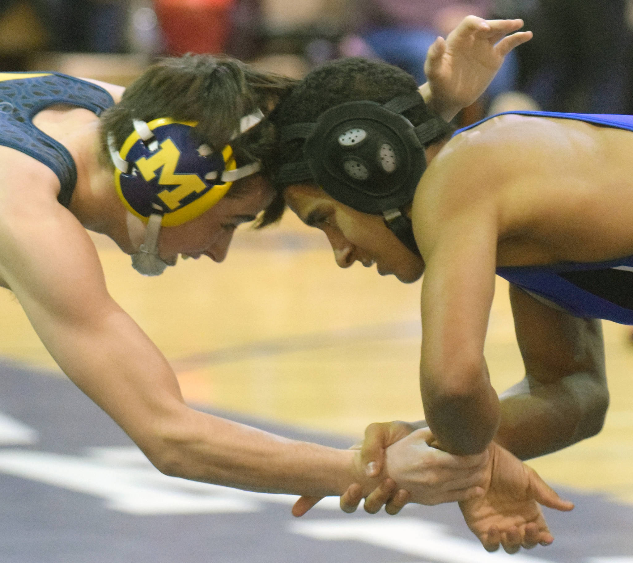 Homer’s Seth Inama and Soldotna’s Ben Booth tangle at 125 pounds Tuesday, Nov. 27, 2018, at Soldotna Prep. Inama would score a major decision. (Photo by Jeff Helminiak/Peninsula Clarion)