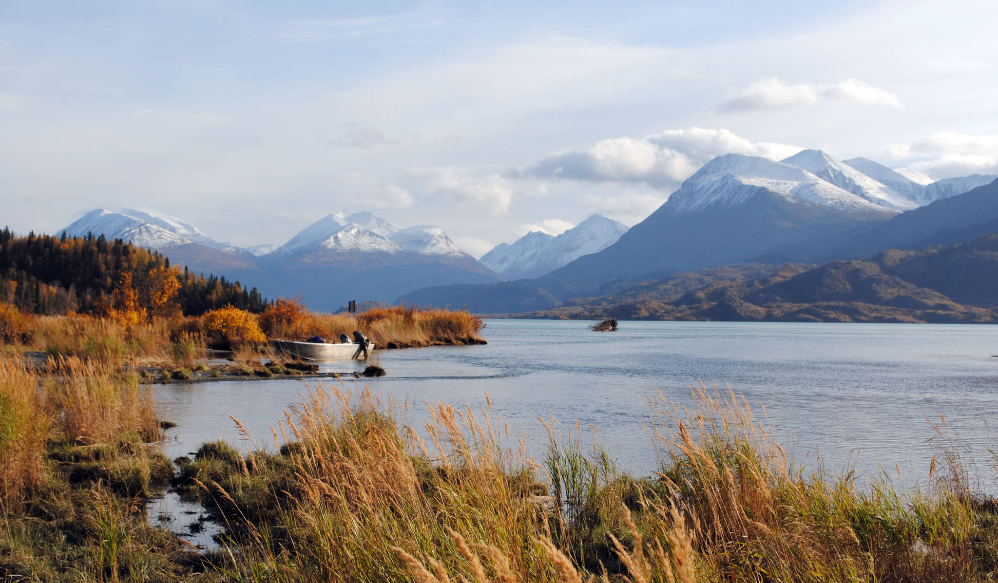 A boat is tethered to the shore of Skilak Lake on the Kenai Peninsula in Alaska on Oct. 11, 2017 during a fly fishing trip. (Photo by Kat Sorensen/Peninsula Clarion)