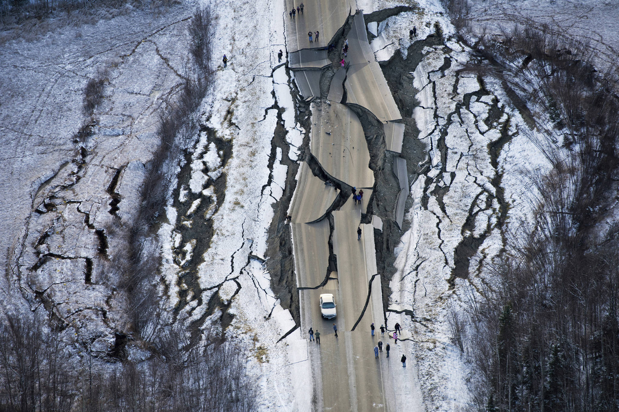 This aerial photo shows damage on Vine Road, south of Wasilla, Alaska, after earthquakes Friday, Nov. 30, 2018. Back-to-back earthquakes measuring 7.0 and 5.7 shattered highways and rocked buildings Friday in Anchorage and the surrounding area, sending people running into the streets and briefly triggering a tsunami warning for islands and coastal areas south of the city. (Marc Lester/Anchorage Daily News via AP)                                This aerial photo shows damage on Vine Road, south of Wasilla, Alaska, after earthquakes Friday, Nov. 30, 2018. Back-to-back earthquakes measuring 7.0 and 5.7 shattered highways and rocked buildings Friday in Anchorage and the surrounding area, sending people running into the streets and briefly triggering a tsunami warning for islands and coastal areas south of the city. (Marc Lester/Anchorage Daily News via AP)