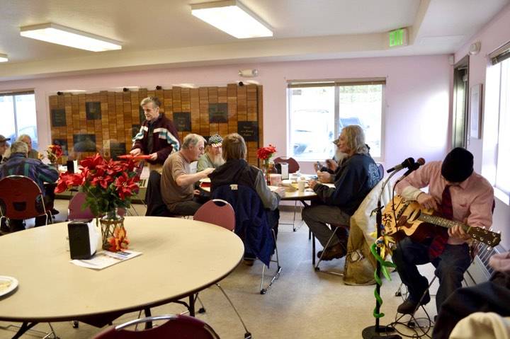 Live music is played at the Kenai Peninsula Food Bank during in an early Thanksgiving meal on Wednesday, Nov. 21, 2018, near Soldotna, Alaska. (Photo by Victoria Petersen/Peninsula Clarion)