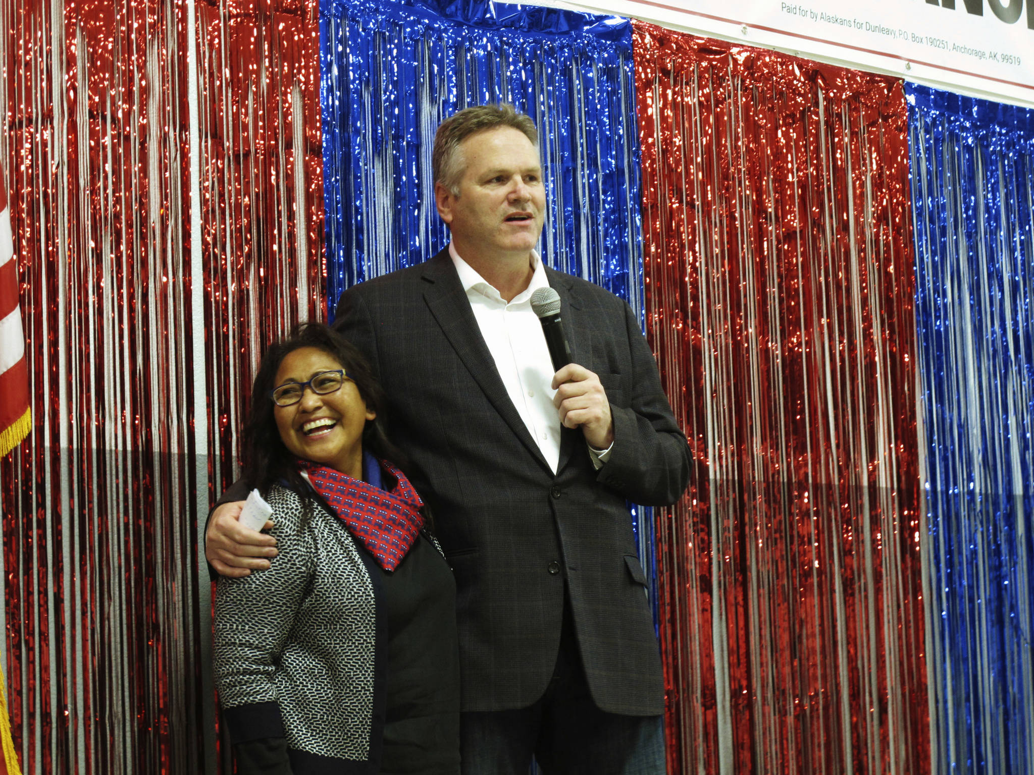 In this Nov. 4, 2018 file photo, Alaska Republican gubernatorial candidate Mike Dunleavy stands with his wife, Rose, on stage during a GOP rally in Anchorage, Alaska. Alaska Gov.-elect Mike Dunleavy takes office Monday, Dec. 3, days after a magnitude 7.0 earthquake rocked heavily-populated south-central Alaska. (AP Photo/Becky Bohrer, File)