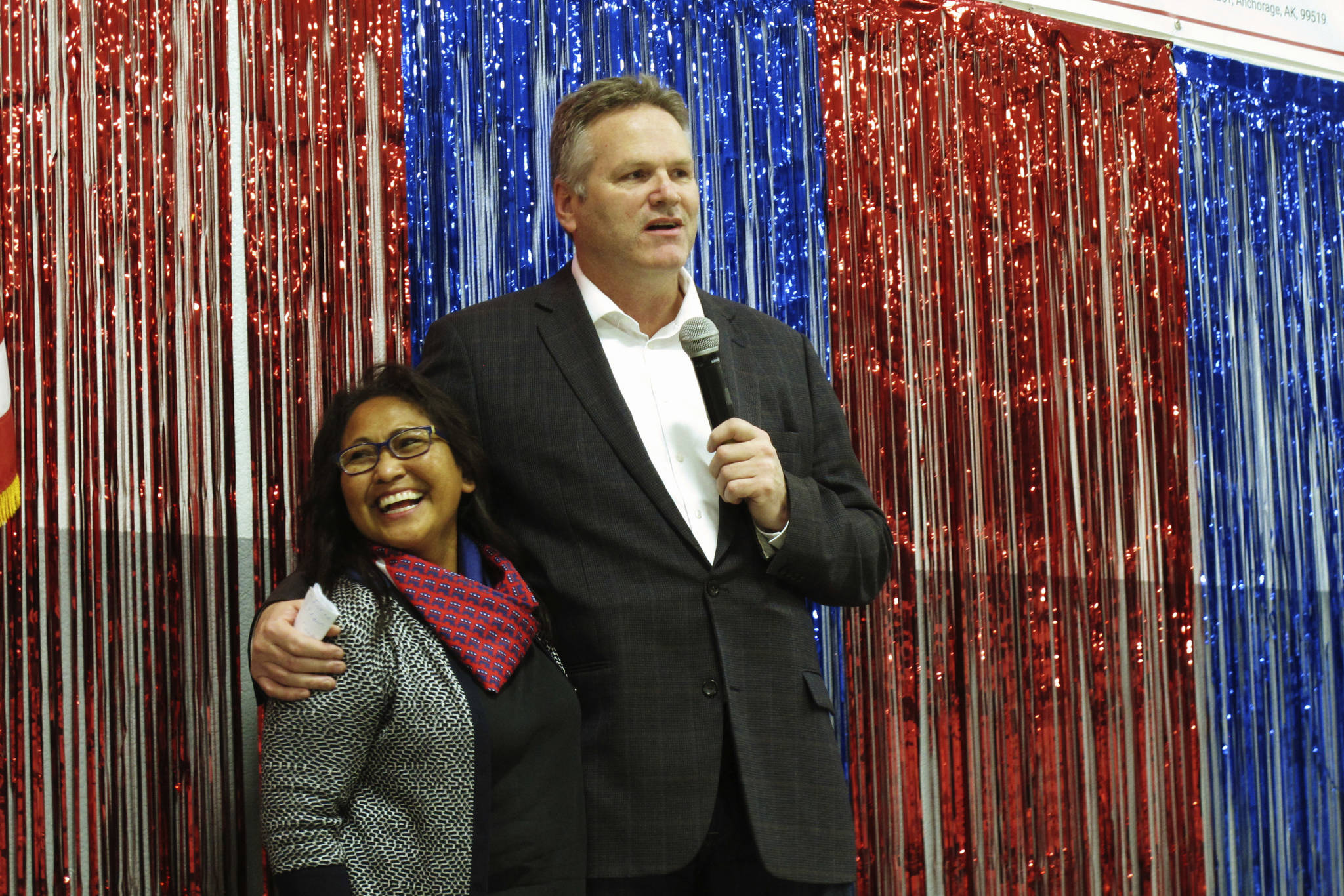 In this Nov. 4, 2018 file photo, Alaska Republican gubernatorial candidate Mike Dunleavy stands with his wife, Rose, on stage during a GOP rally in Anchorage, Alaska. Alaska Gov.-elect Mike Dunleavy takes office Monday, Dec. 3, days after a magnitude 7.0 earthquake rocked heavily-populated south-central Alaska. (AP Photo/Becky Bohrer, File)