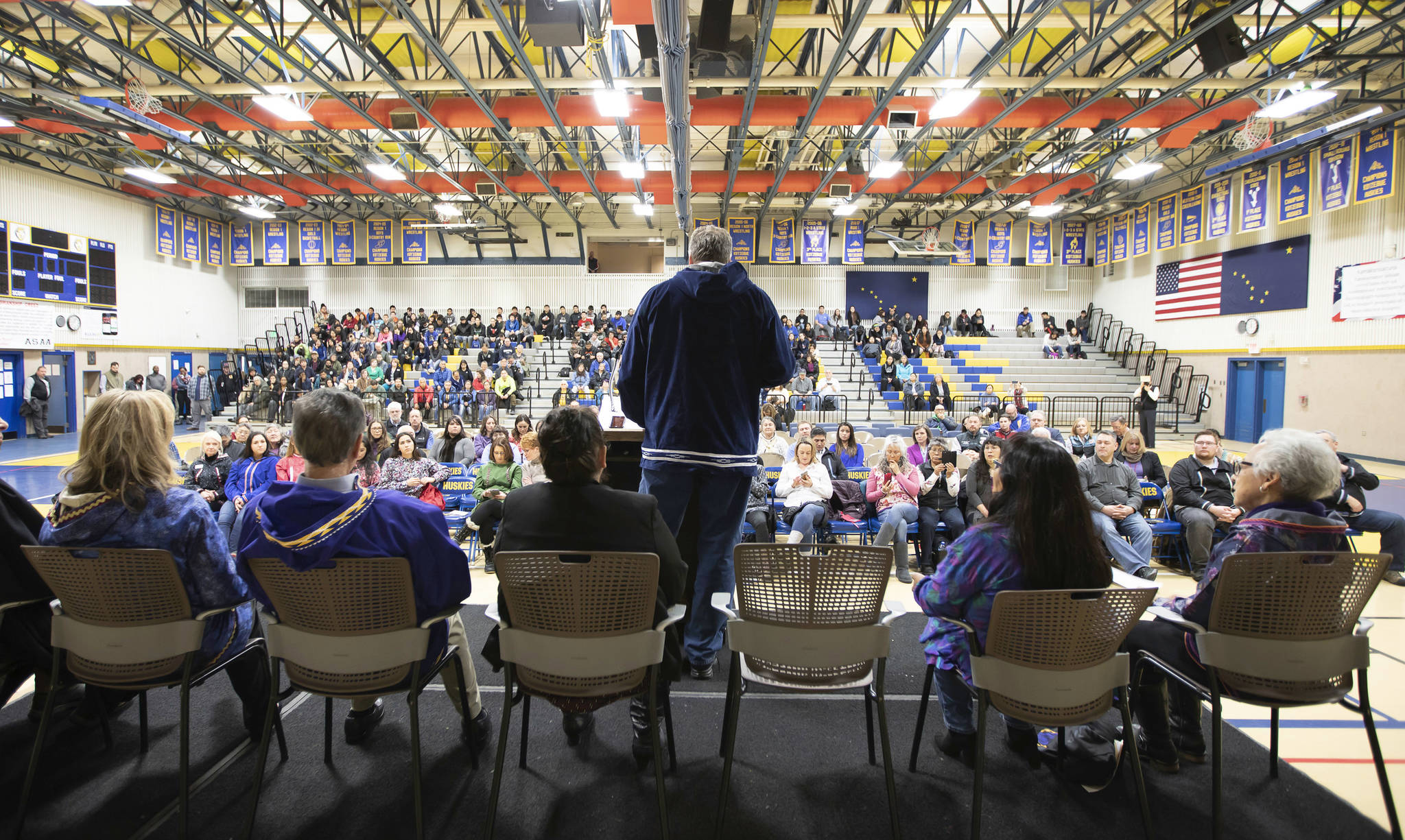 Alaska Gov. Mike Dunleavy addresses the audience in the school gym in Kotzebue, Alaska, after he was sworn into office Monday, Dec. 3, 2018. He had originally planned the ceremony in his wife’s hometown of Noorvik, Alaska, but poor weather prevented his plane from landing there and the ceremony was moved to Kotzebue.(Stanley Wright/Alaska Governor’s Office via AP)