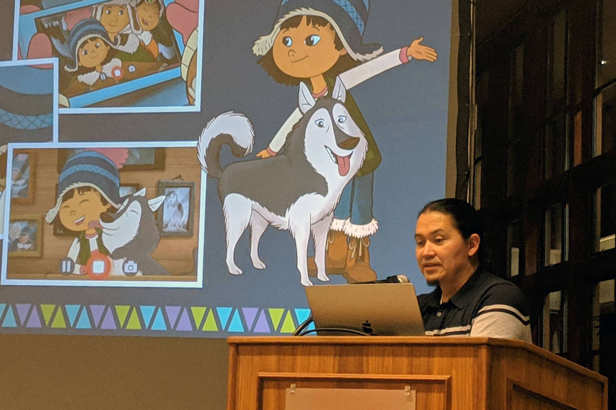 University of Alaska Southeast professor <span style="text-decoration: underline;">X</span>’unei Lance Twitchell filled in for the Evening at Egan presentation about “Molly of Denali” Friday, Nov. 30. He introduced the crowd at UAS’s Egan Library to the show’s characters, including Molly’s dog, Suki. (Ben Hohenstatt | Capital City Weekly)