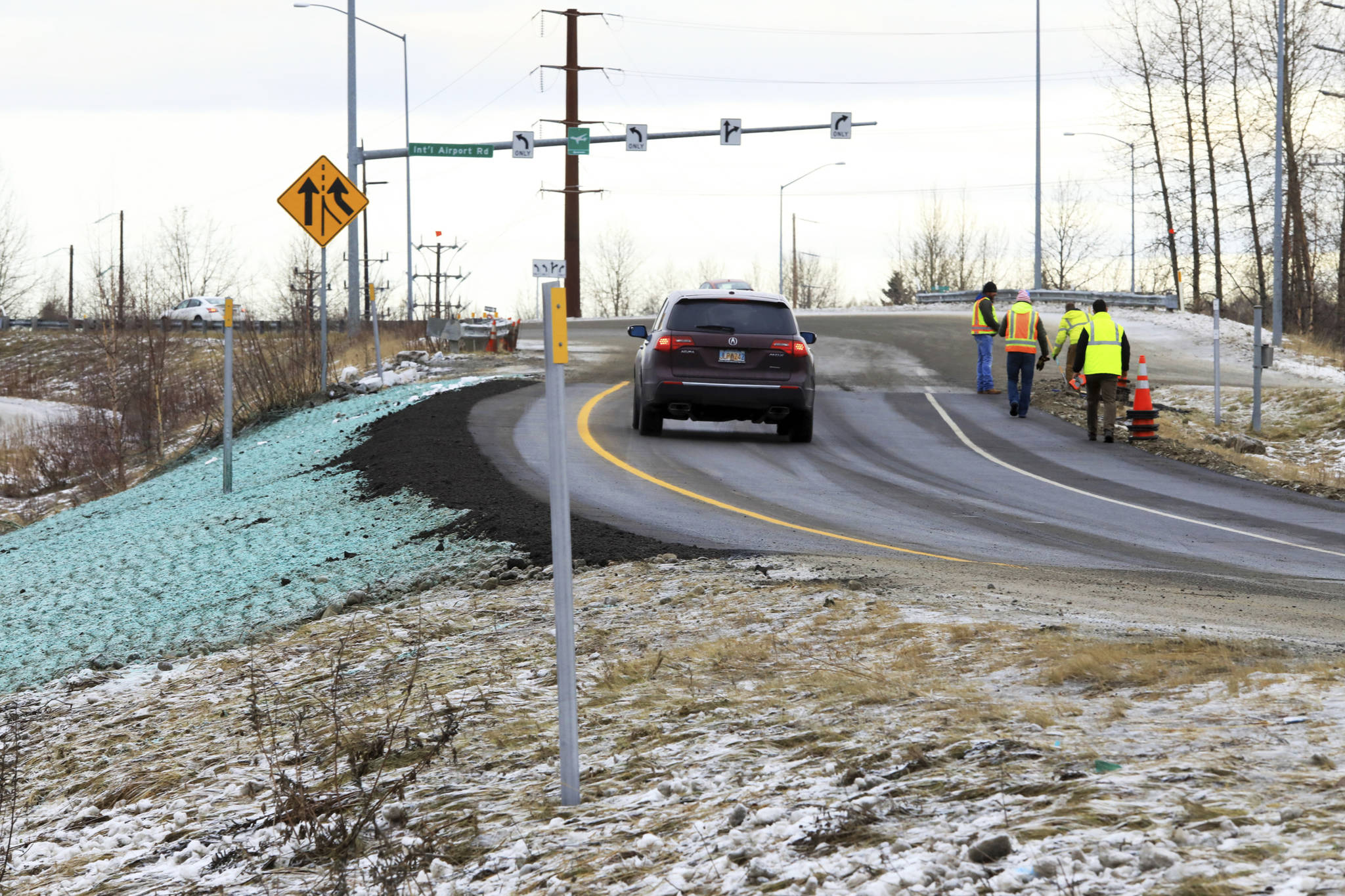 A car ascends a newly repaired off-ramp of Minnesota Drive on Wednesday, Dec. 5, 2018, in Anchorage, Alaska. A massive 7.0 earthquake and its aftershocks rocked buildings and buckled roads Nov. 30, including the road that’s a route to Ted Stevens Anchorage International Airport. Alaska transportation officials made rebuilding the ramp a priority. It reopened Tuesday, Dec. 4, and a crew completed shoulder work Wednesday. (AP Photo/Dan Joling)