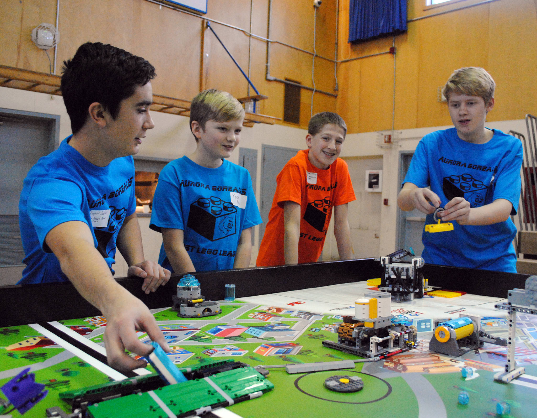 Team members from the Aurora Borealis ‘Polar Bears’ practice their robots programming during Saturday’s First Lego League at Aurora Borealis Charter School. The competition challenges students to solve an issue with legos, teamwork and some engineering. The team went home with the Champion’s Award and will continue on to the state competition in Anchorage. (Photo by Kat Sorensen/Peninsula Clarion)