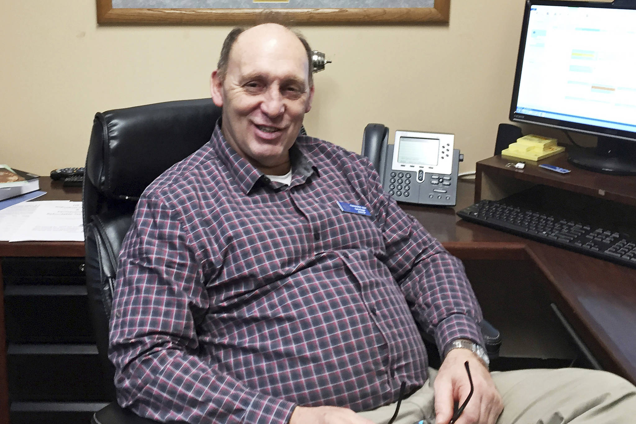 In this Jan. 16, 2017, file photo, then Rep.-elect Gary Knopp sits in his office at the Alaska Capitol in Juneau, Alaska. Republican state lawmaker Knopp is seeking to create a bipartisan majority coalition in the House after leaving a fragile GOP caucus that he said was “doomed to fail.” Knopp says he wanted to start talks on the potential creation of a bipartisan coalition, with just weeks before the start of the new legislative session. (AP Photo/Becky Bohrer, File)