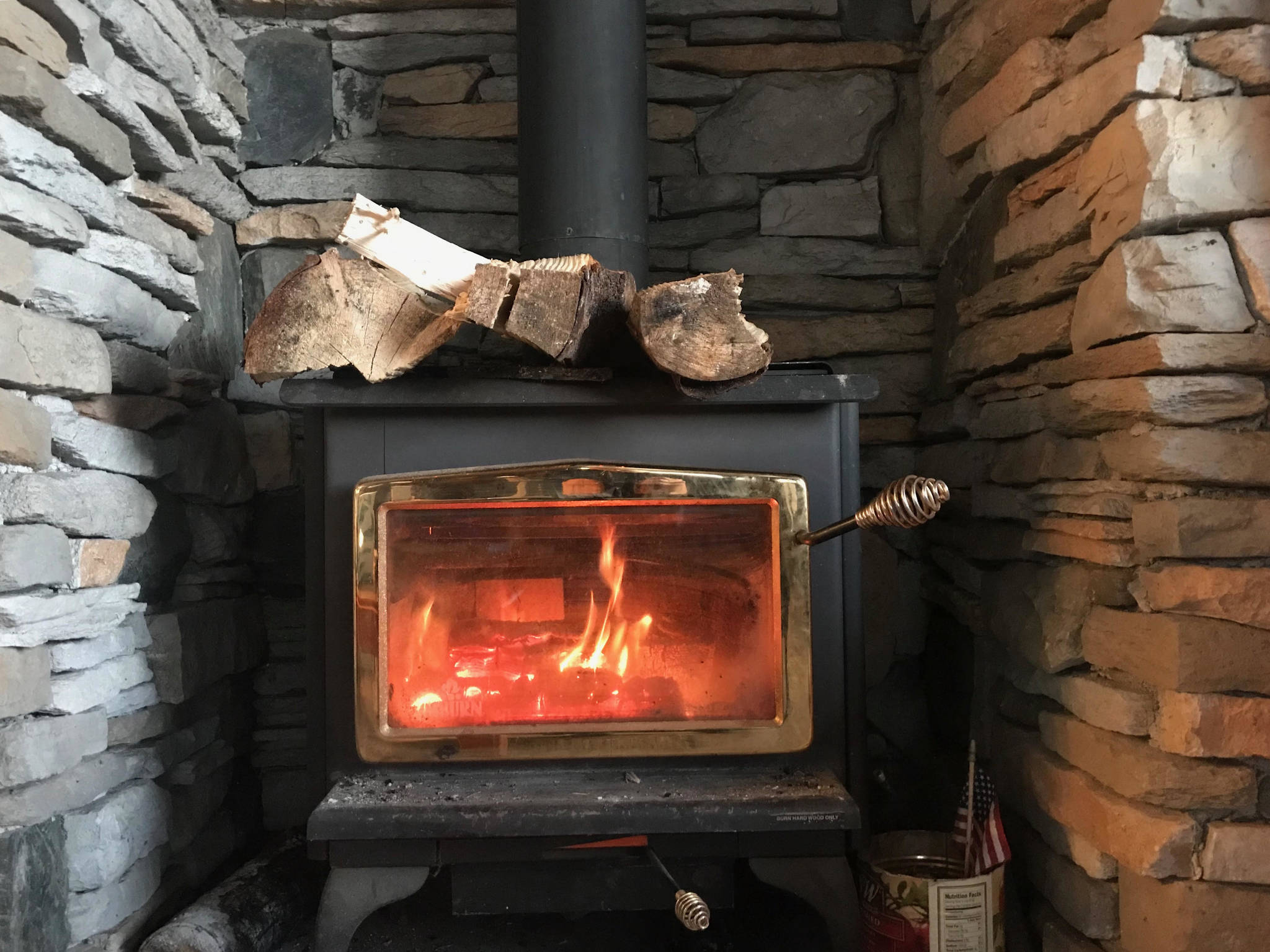 The author’s wood stove can be seen here, heating a room and causing trouble. (Photo by Kat Sorensen/Peninsula Clarion)