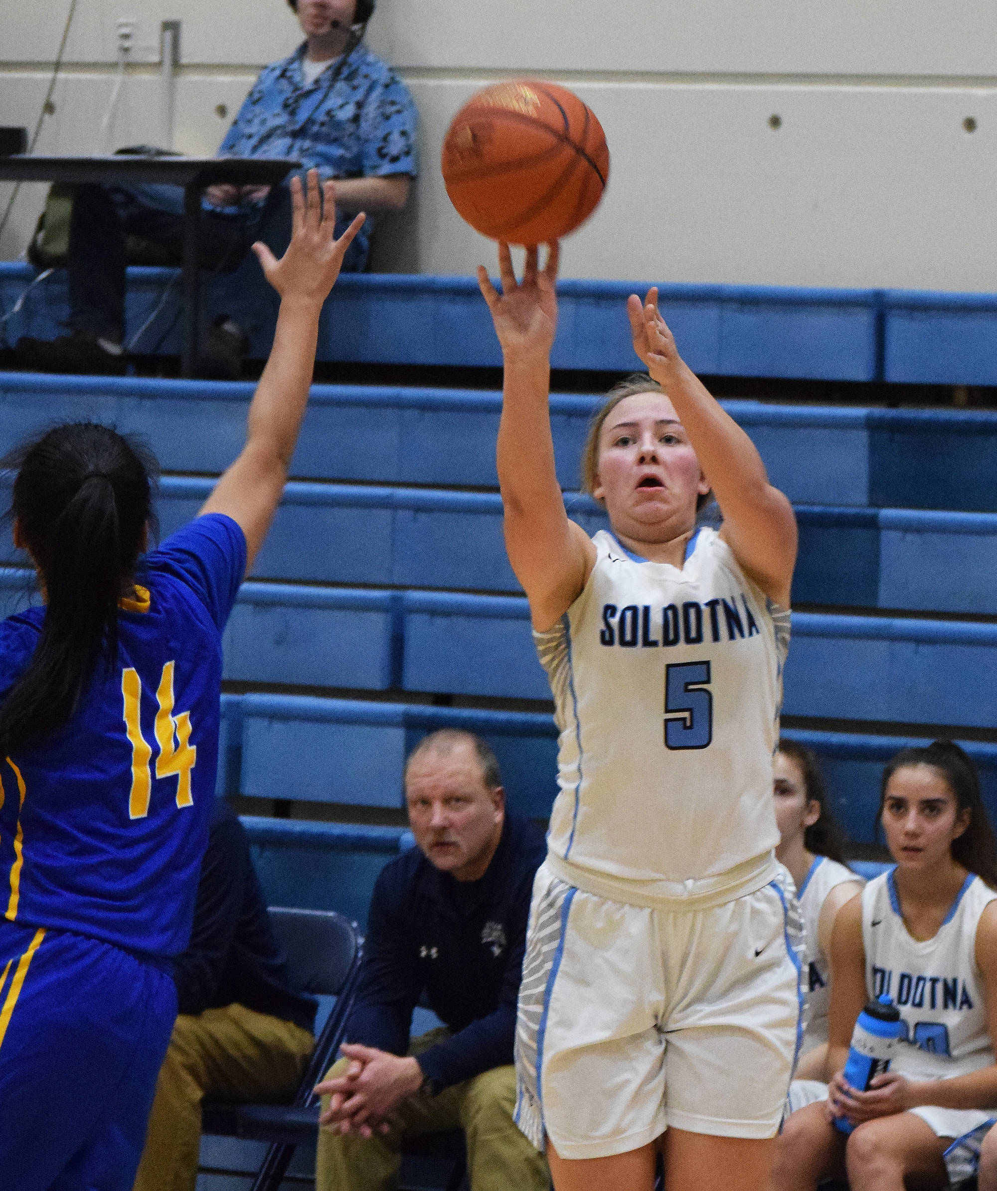Soldotna’s Brittani Blossom launches a 3-point shot Friday night over Kodiak defender Lisa Marcelo at the Powerade/Al Howard Tip-Off tournament at Soldotna. (Photo by Joey Klecka/Peninsula Clarion)