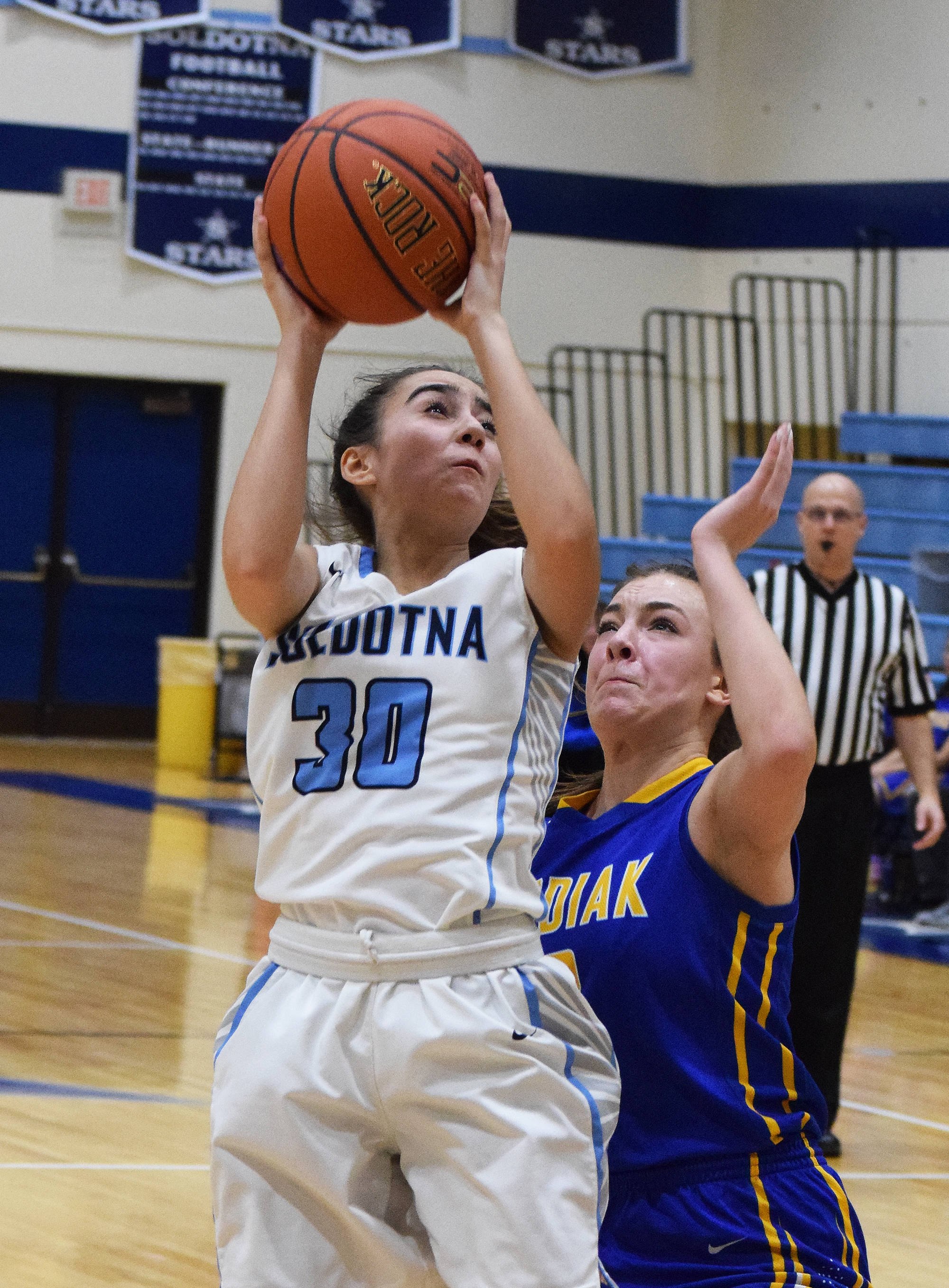 Soldotna’s Drysta Crosby-Schneider (30) shoots over a Kodiak defender Friday night at the Powerade/Al Howard Tip-Off tournament at Soldotna. (Photo by Joey Klecka/Peninsula Clarion)
