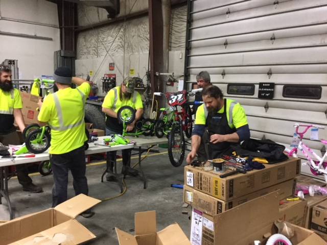 Alaska Waste workers prepare bikes for donation to Love Inc. (Photo: Josue Rivera-Cruz/Alaska Waste)