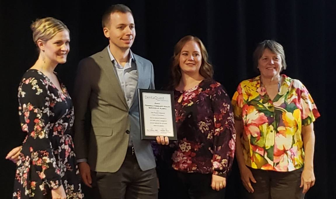 The Peninsula Community Health Services Dental team accepts their award at the National Network for Oral Health Access Conference, held last month in New Orleans, Louisiana. (Photo courtesy of PCHS)