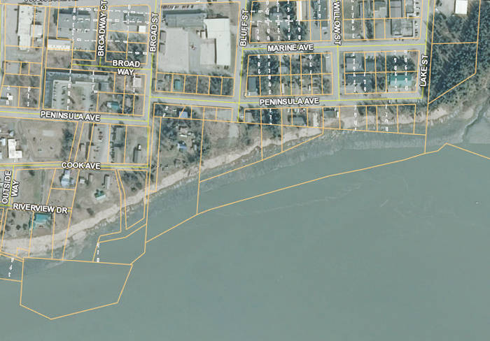 This satellite image from the Kenai Peninsula Borough’s parcel viewer shows an area of Old Town Kenai, on the blufftop overlooking the Kenai River mouth, where erosion has eaten away previously-existing land. (File photo)