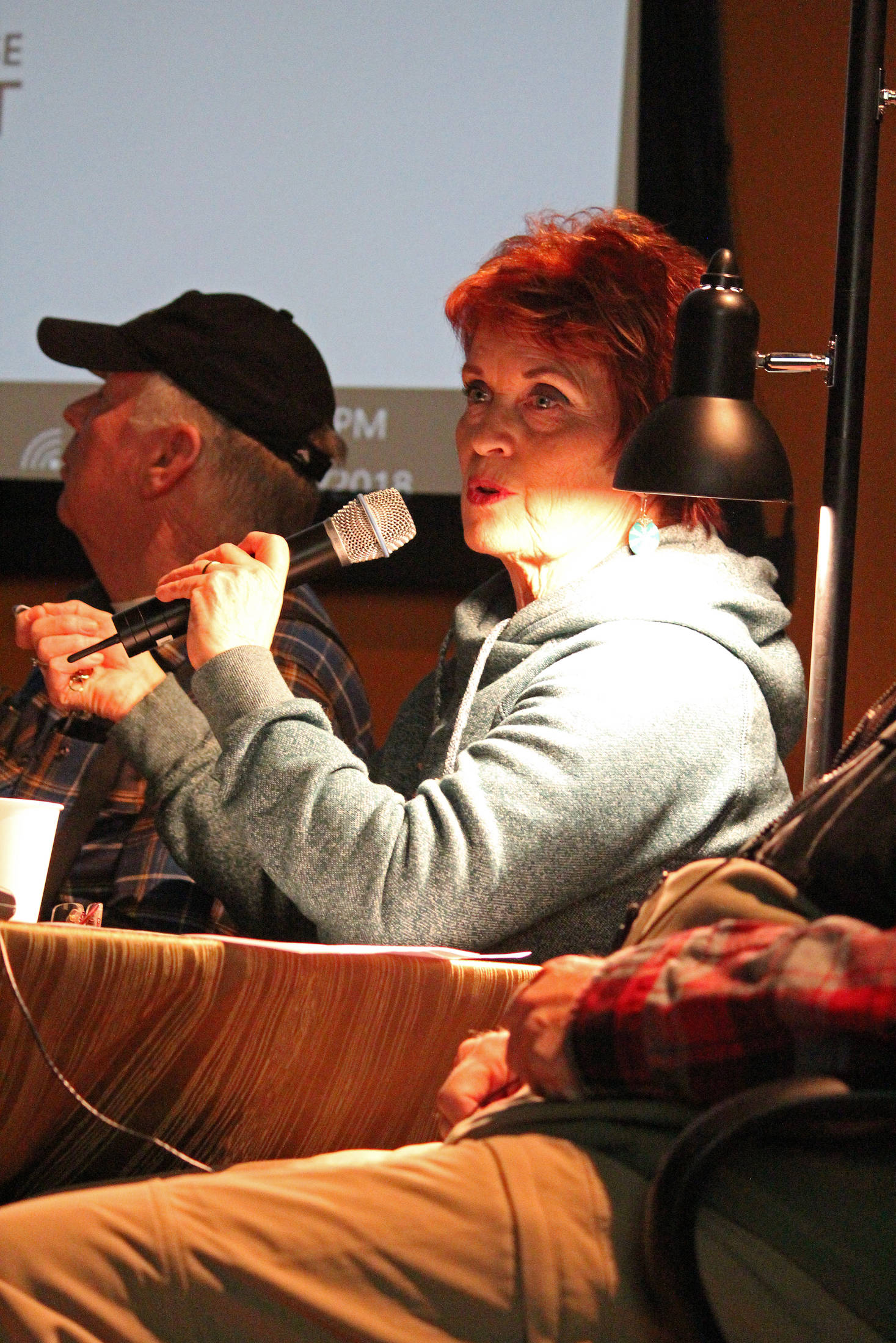 Joyce Anderson Turkington introduces herself and where she grew up during a presentation of Homestead Kids: Tales from the North Fork on Thursday, Dec. 13, 2018 at the Alaska Islands and Oceans Visitor Center in Homer, Alaska. (Photo by Megan Pacer/Homer News)