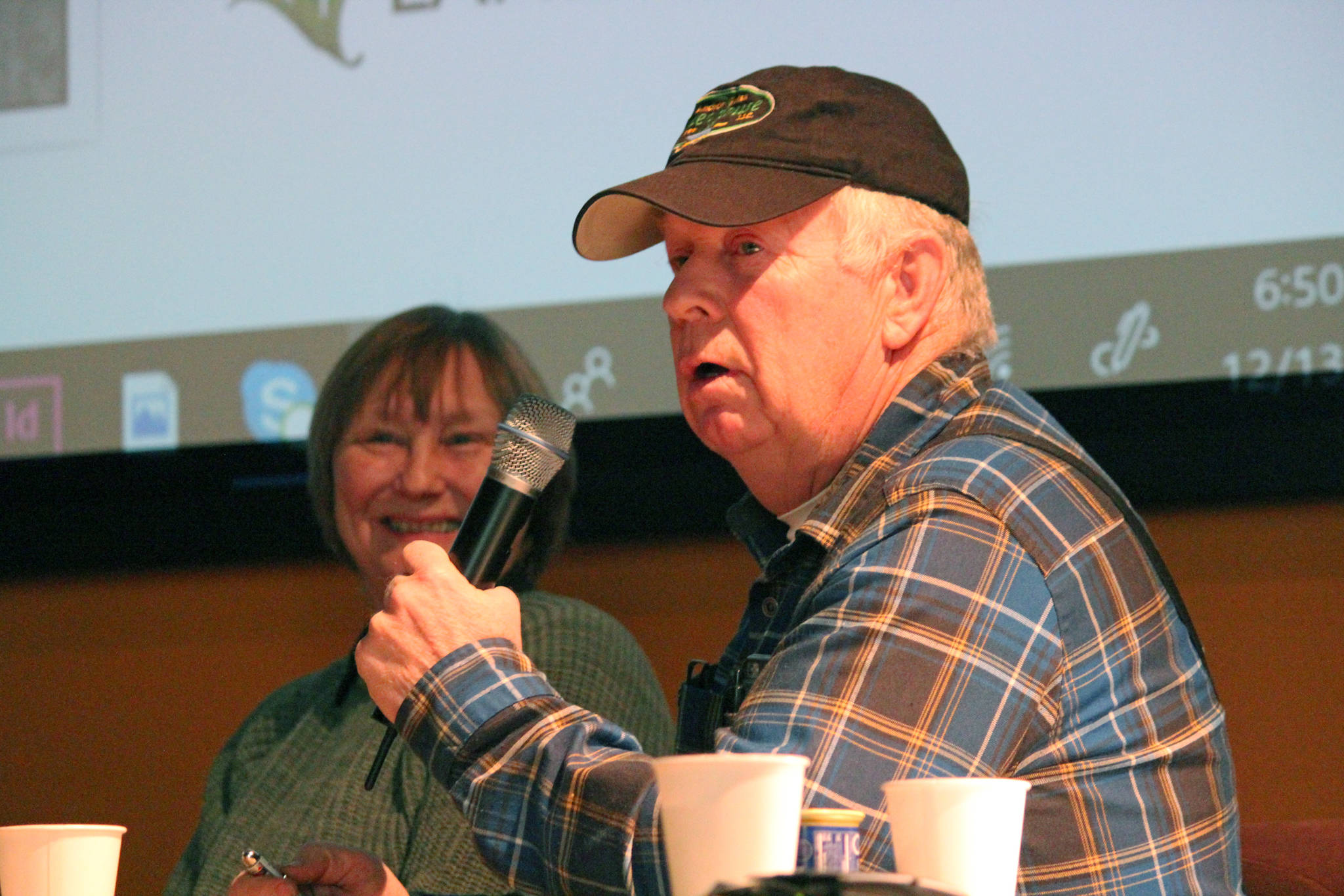 Al Poindexter addresses the crowd at a presentation of Homestead Kids: Tales from the North Fork on Thursday, Dec. 13, 2018 at the Alaska Islands and Oceans Center in Homer, Alaska. (Photo by Megan Pacer/Homer News)