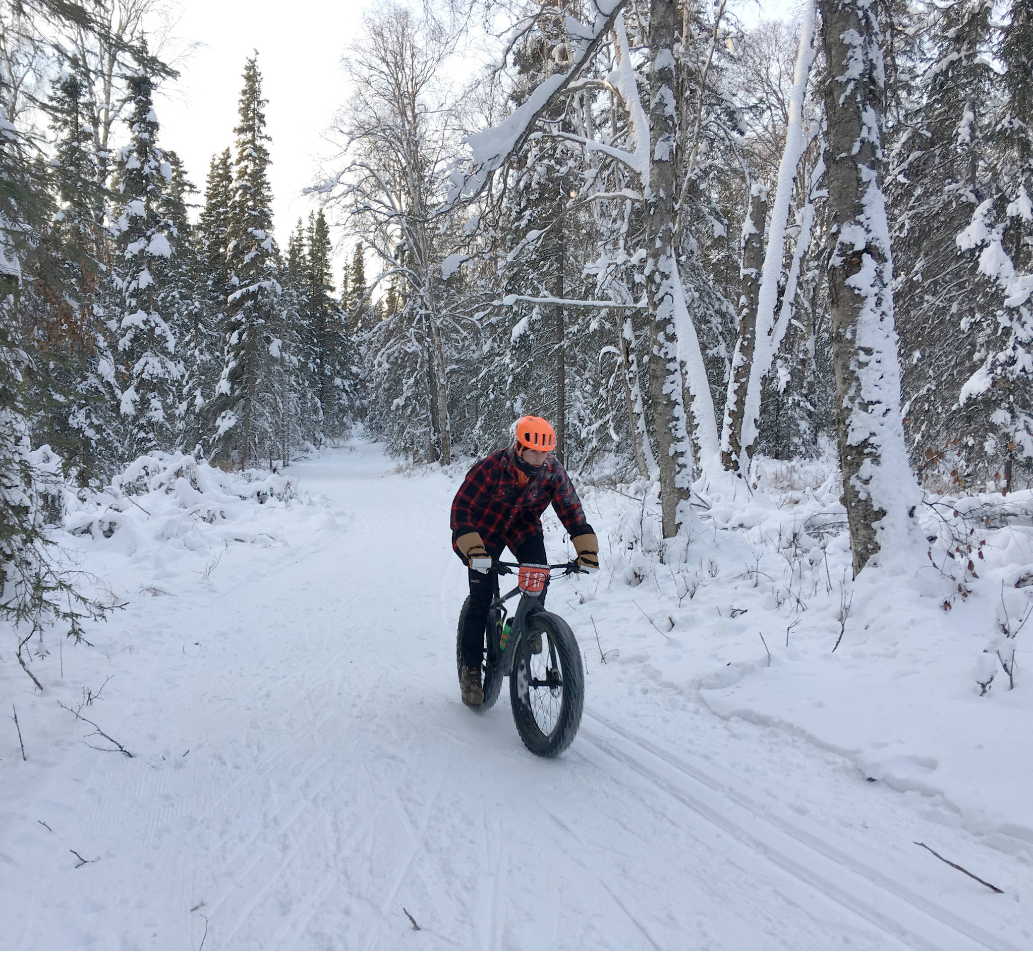 Tyle Owens rides to victory Sunday, Dec. 23, 2018, in Freezer Food Series Race 5, a six-mile fat bike race at the Slikok Trails outside of Soldotna. (Photo by Jeff Helminiak/Peninsula Clarion)