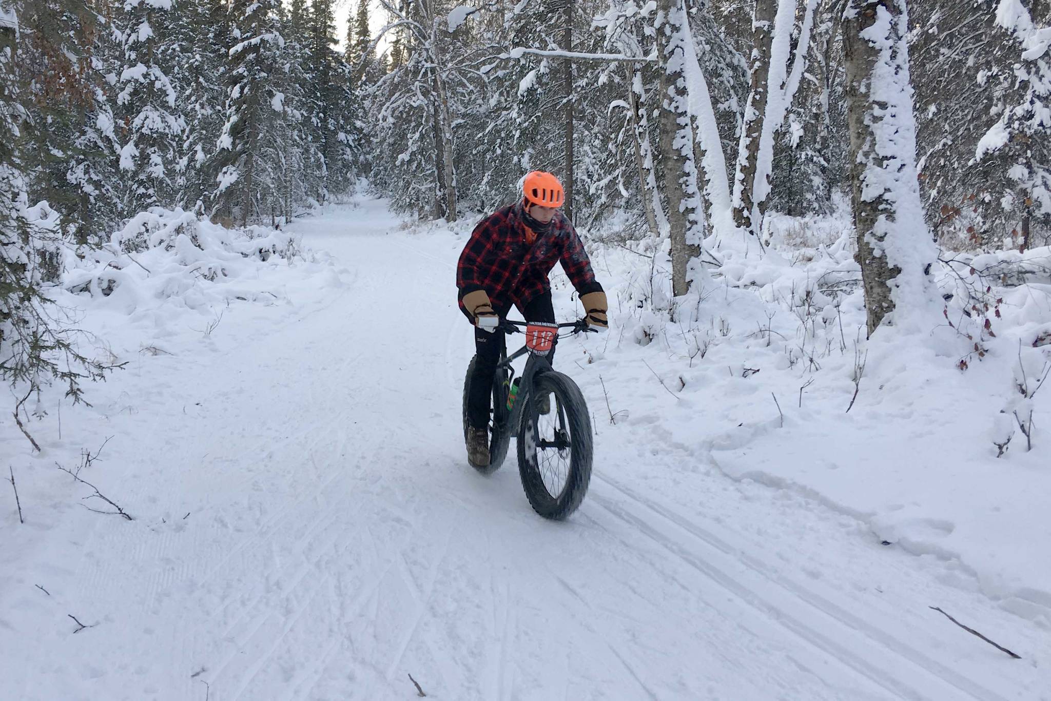 Tyle Owens rides to victory Sunday, Dec. 23, 2018, in Freezer Food Series Race 5, a six-mile fat bike race at the Slikok Trails outside of Soldotna. (Photo by Jeff Helminiak/Peninsula Clarion)