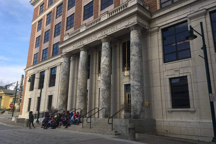 Students sit on the front steps of the Alaska Capitol on April 6, 2018. (James Brooks photo | Juneau Empire)