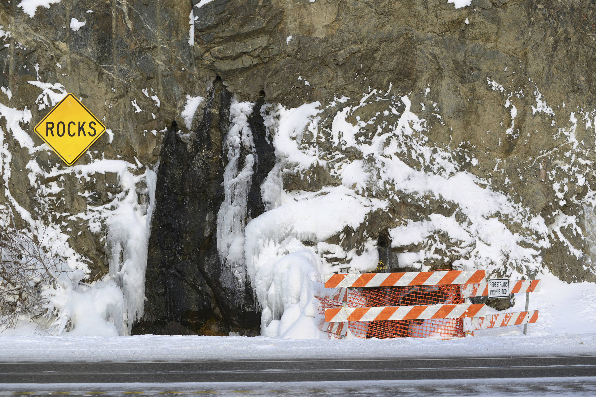 In this Dec. 21 photo the highway littered with rockfall south of Anchorage. (Anne Raup/Anchorage Daily News via AP)