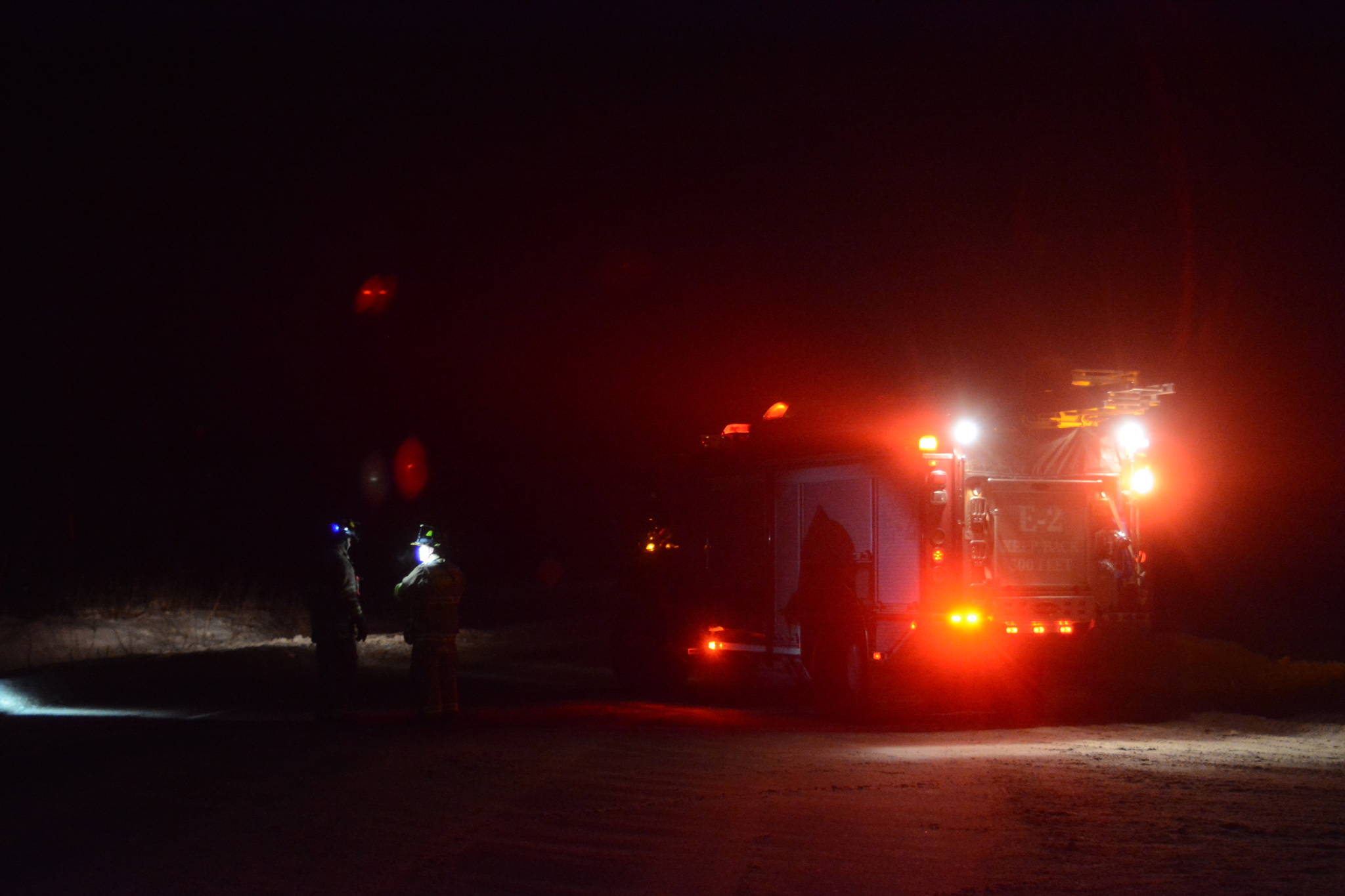 Kachemak Emergency Services firefighters blocked off the Sterling Highway at Diamond Ridge Road at about 10:20 p.m. Thursday, Dec. 27, 2018, in Homer Alaska. (Photo by Michael Armstrong/Homer News)