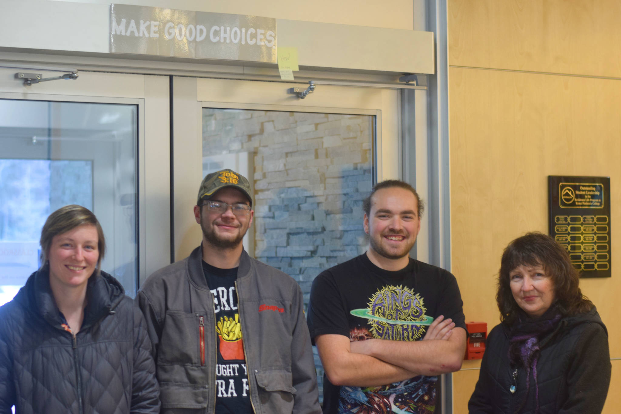 Ariane Jasmine, Brett Knighten, Skyler Diehl and Diane Taylor pose inside the residence hall at Kenai Peninsula College’s Kenai River Campus on Tuesday. (Photo by Brian Mazurek/Peninsula Clarion)