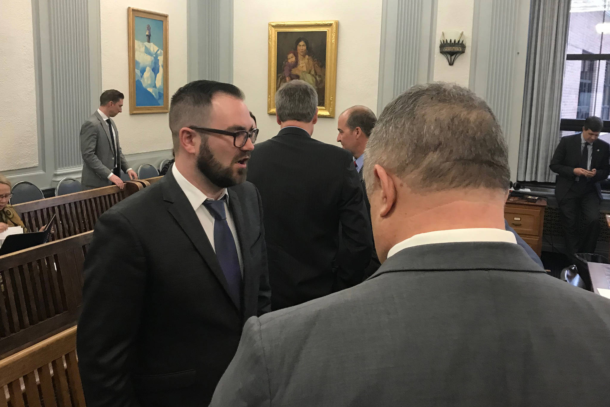 Department of Administration Commissioner Designee John Quick, left, speaks with senators after talking to the Senate Finance Committee on Tuesday, Jan. 22, 2019. (Alex McCarthy | Juneau Empire)