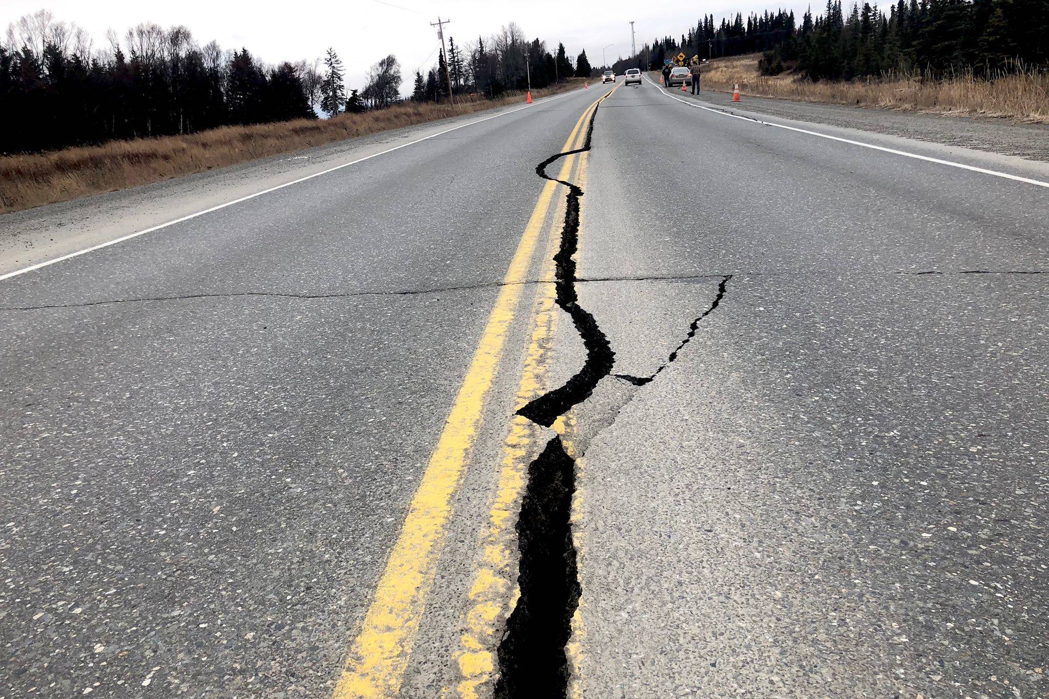 A crack runs through the center lane of the Kenai Spur Highway near Nikiski. The highway suffered minor damage after the Nov. 30, 2018, earthquake. (Photo by Victoria Petersen/Peninsula Clarion)