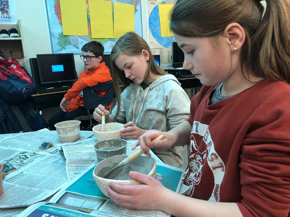 Fifth-graders at Soldotna Elementary school worked on pottery projects this week for a fundraiser that will buy new playground equipment for the school on Thursday, in Soldotna. (Photo by Victoria Petersen/Peninsula Clarion)