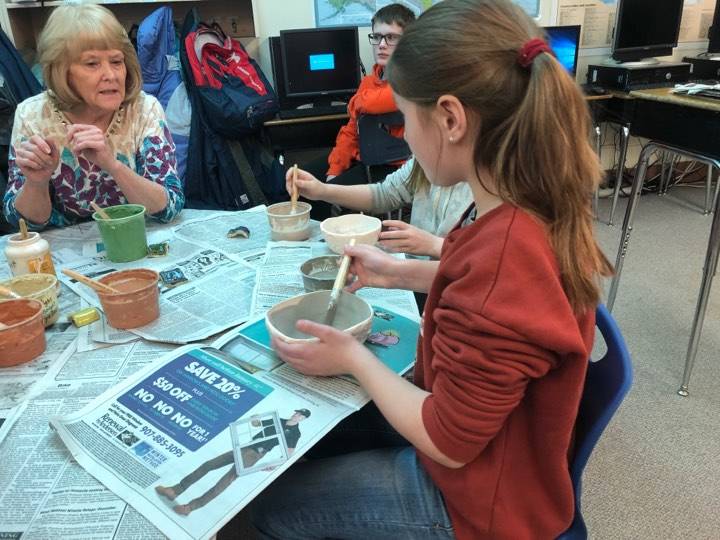 Fifth-graders at Soldotna Elementary school worked on pottery projects with Debbie Adamson, president of the Kenai Potters Guild, for a fundraiser that will buy new playground equipment for the school on Thursday, in Soldotna. (Photo by Victoria Petersen/Peninsula Clarion)