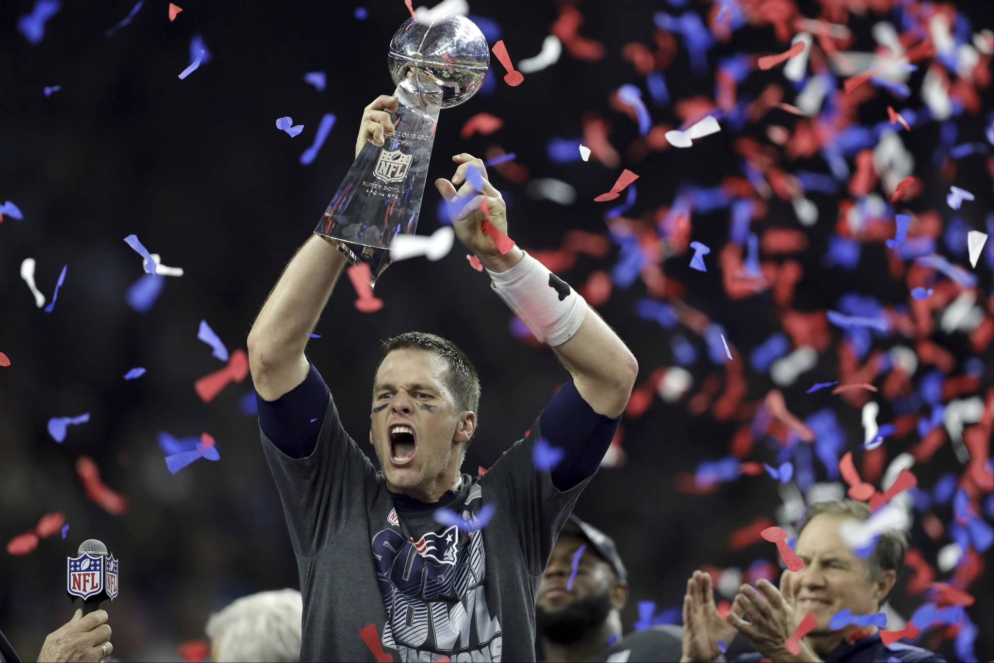 In this Feb. 5, 2017, file photo, New England Patriots’ Tom Brady raises the Vince Lombardi Trophy after defeating the Atlanta Falcons in overtime at the NFL Super Bowl 51 football game, in Houston. With five rings Tom Brady has already established himself as the most-decorated quarterback in Super Bowl history. (AP Photo/Darron Cummings, File)