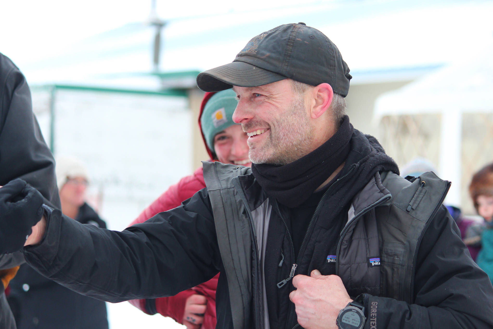 Musher Dave Turner celebrates just after winning this year’s Tustumena 200 Sled Dog Race on Sunday, Jan. 27, 2019 at Freddies Roadhouse finish line near Ninilchik, Alaska. (Photo by Megan Pacer/Homer News)