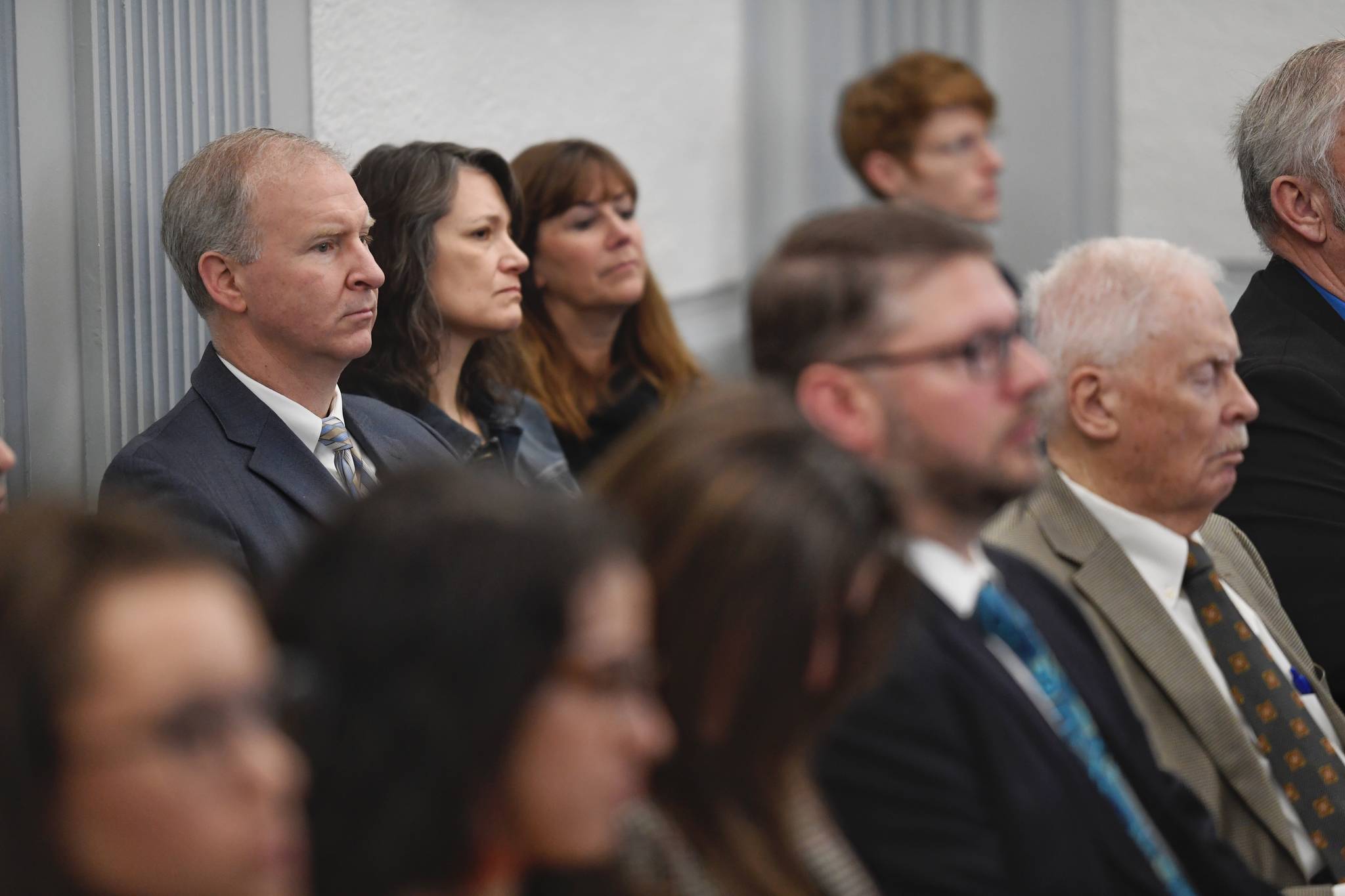 Brian Holst, president of the Juneau School District’s Board of Education, left, Kristin Bartlett, JSD Chief of Staff, center, and Bridget Weiss, JSD Superintendent, watch from the gallery as the Senate Finance Committee listens to a supplemental budget offered by Gov. Mike Dunleavy’s Office of Management and Budget Director Donna Arduin at the Capitol on Tuesday, Jan. 29, 2019. (Michael Penn | Juneau Empire)