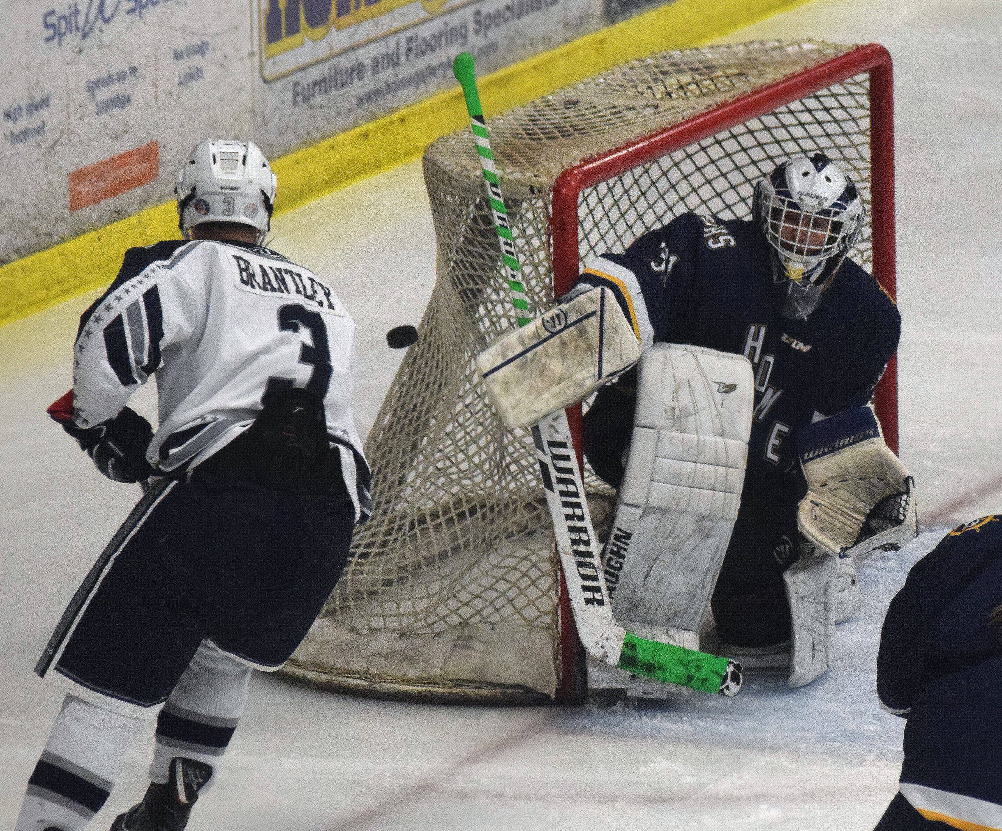 Homer goalie Hunter Warren fends off a shot by Soldotna’s Galen Brantley III Jan. 15, 2019, at the Soldotna Regional Sports Complex. (Photo by Joey Klecka/Peninsula Clarion)