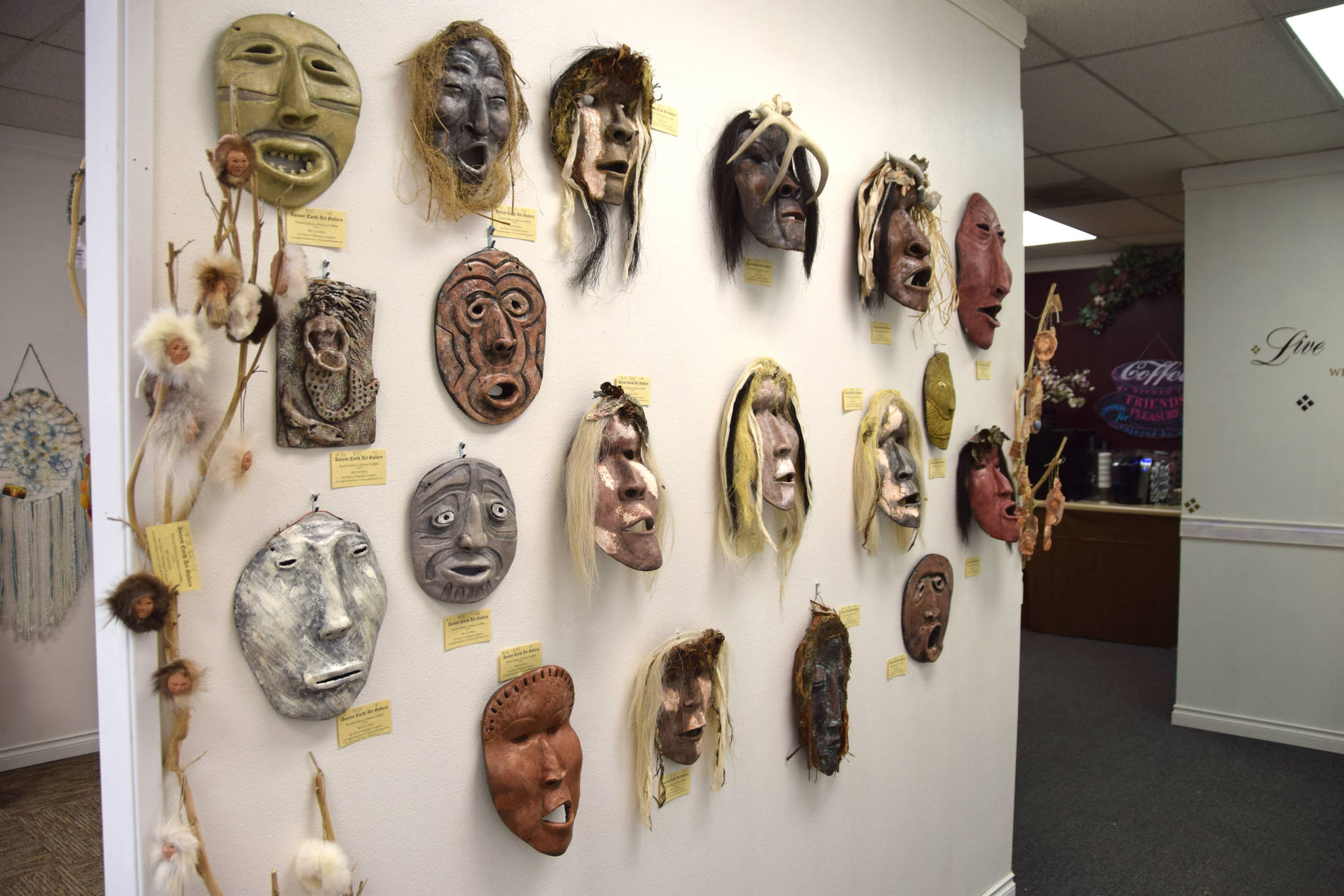 A set of healing masks made by artist Helene Griffith on display at the Positive Vibe gallery in Kenai on Wednesday, Jan. 30, 2019. (Photo by Brian Mazurek/Peninsula Clarion)
