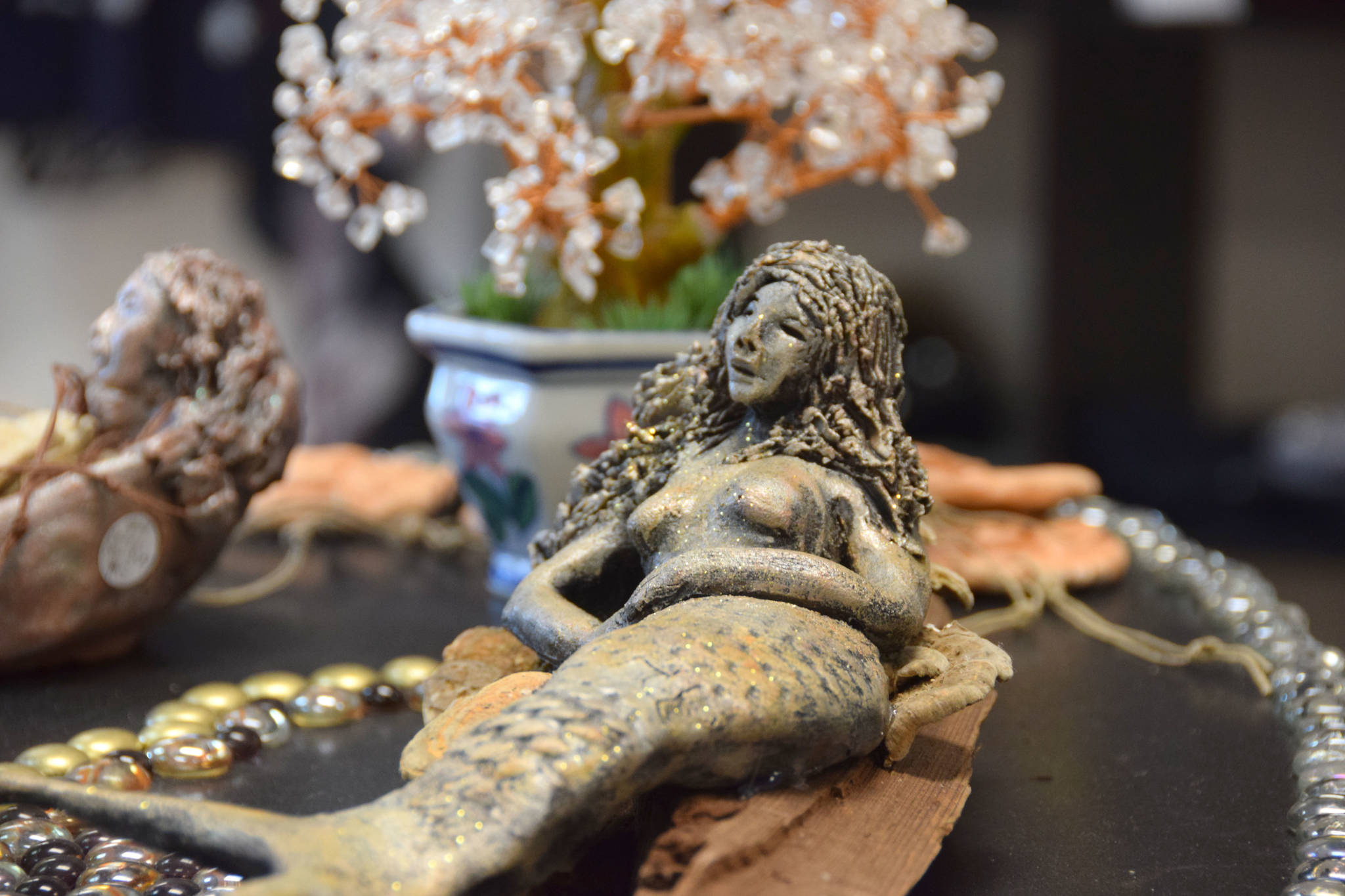A mermaid carving sits on display at the Positive Vibe gallery in Kenai on Wednesday, Jan. 30, 2019. (Photo by Brian Mazurek/Peninsula Clarion)