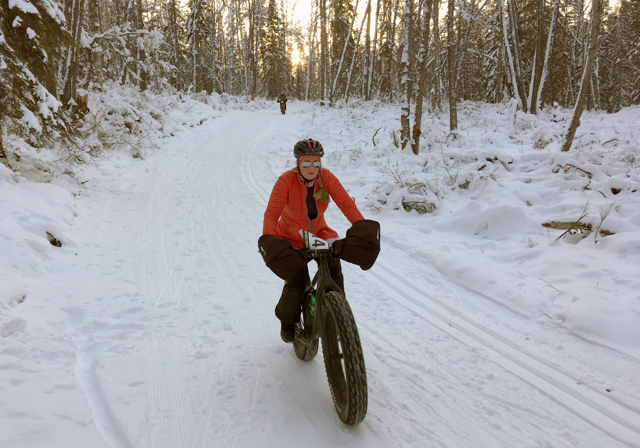 Angie Sulley races her fat bike on the Slikok Trails during the Freezer Food Series on Dec. 23, 2018, just outside of Soldotna. (Photo by Jeff Helminiak/Peninsula Clarion)