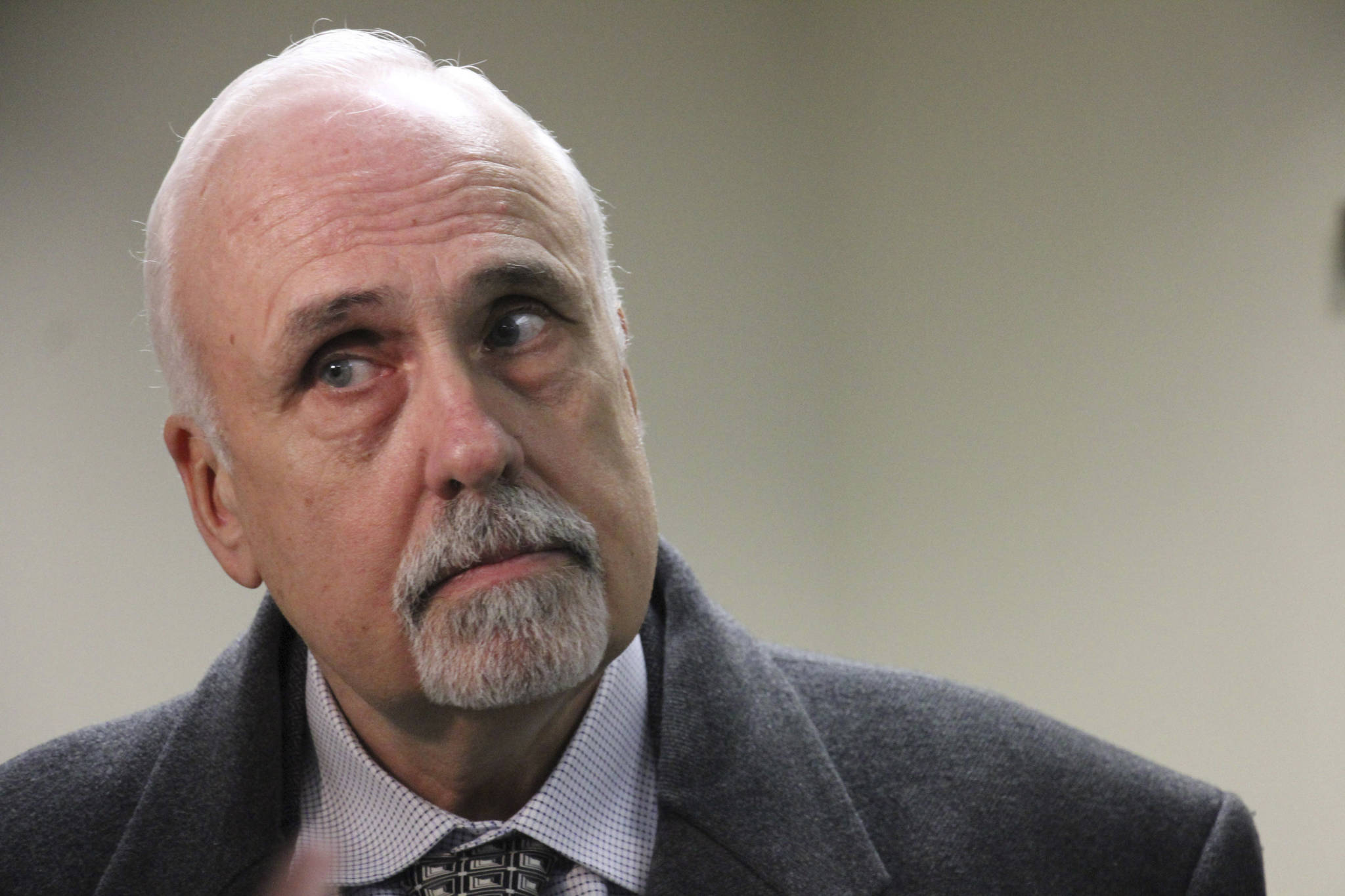 Republican Bart LeBon of Fairbanks listens to a reporter’s question after leaving the Alaska Supreme Court hearing room in Anchorage, Alaska, on Friday, Jan. 4, 2019, where justices heard arguments in a lawsuit disputing his one-vote victory in a state House race. His challenger, Democrat Kathryn Dodge, is challenging the results of a recount that determined LeBon won the open Fairbanks seat. (AP Photo/Mark Thiessen)