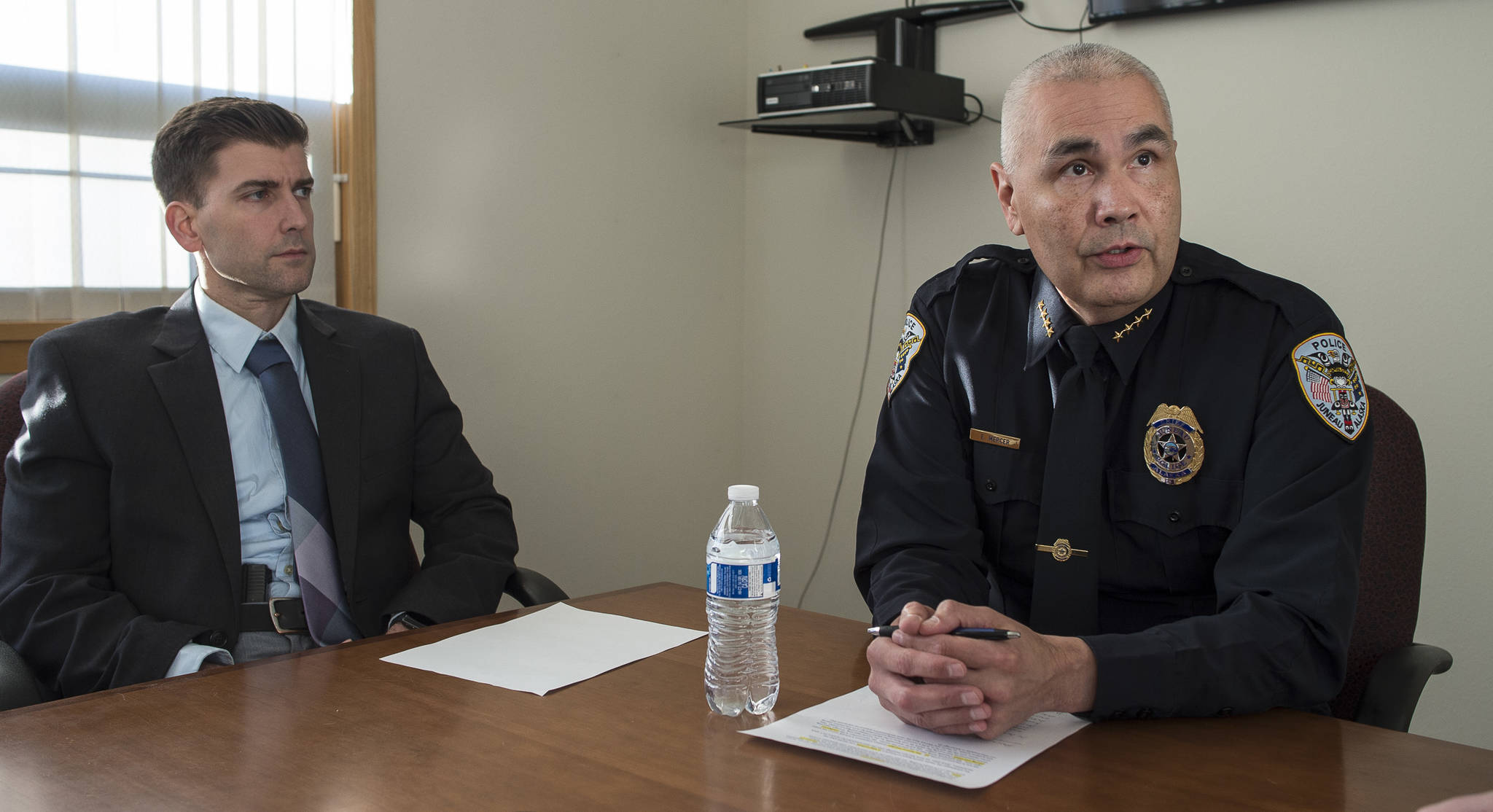 Juneau Police Department Police Chief Ed Mercer, right, and Lt. Jeremy Weske speak at the Juneau Police Station about the department receiving new funding for drug enforcement on Friday, Jan. 4, 2019. Alaska has been designated as a High Intensity Drug Trafficking Area (HIDTA). (Michael Penn | Juneau Empire)