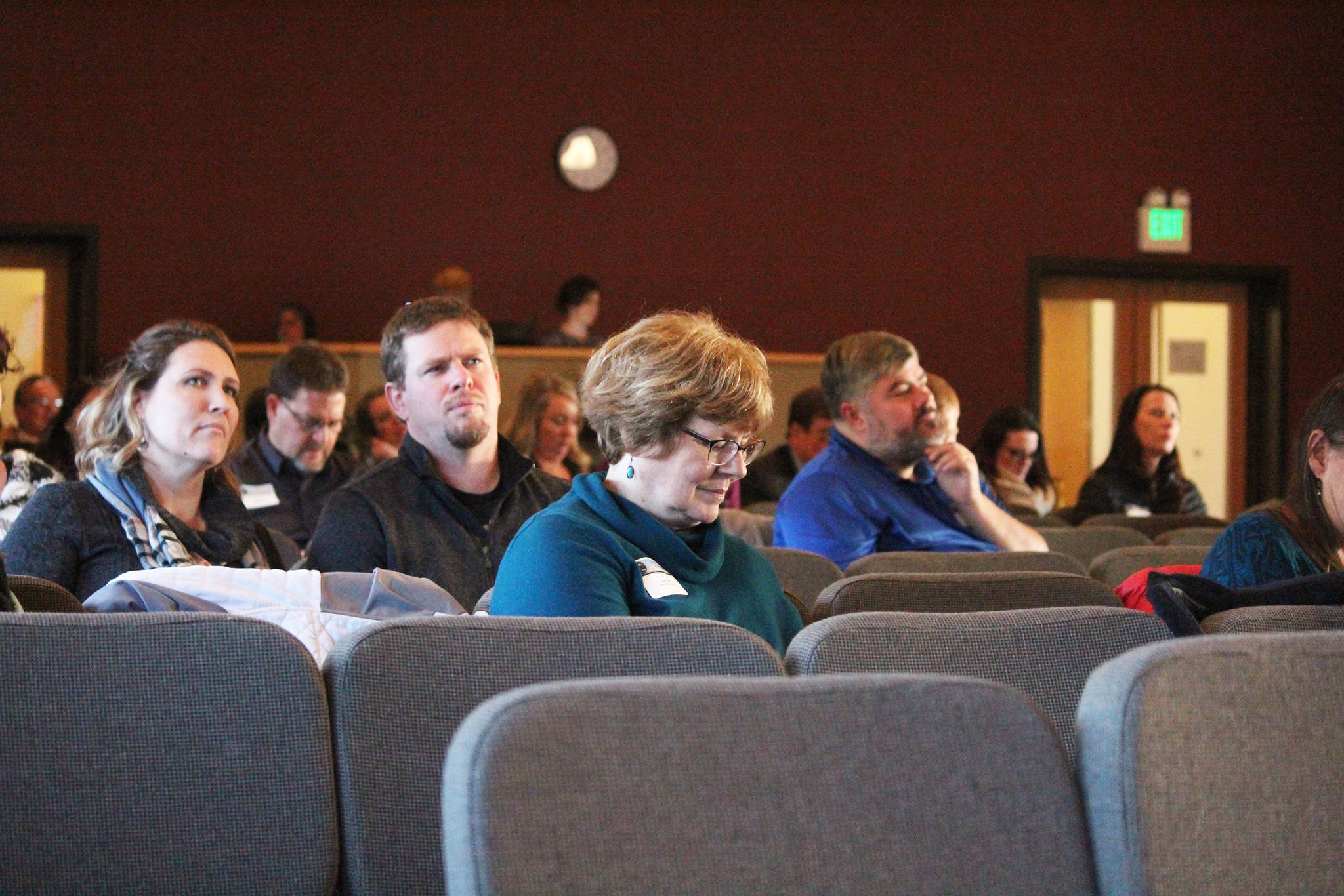 Attendees at this year’s Industry Outlook Forum take part in an electronic game on their phones designed to survey business owners about their level of disaster preparedness on Wednesday, Jan. 9, 2019 at Christian Community Church in Homer, Alaska. (Photo by Megan Pacer/Homer News)