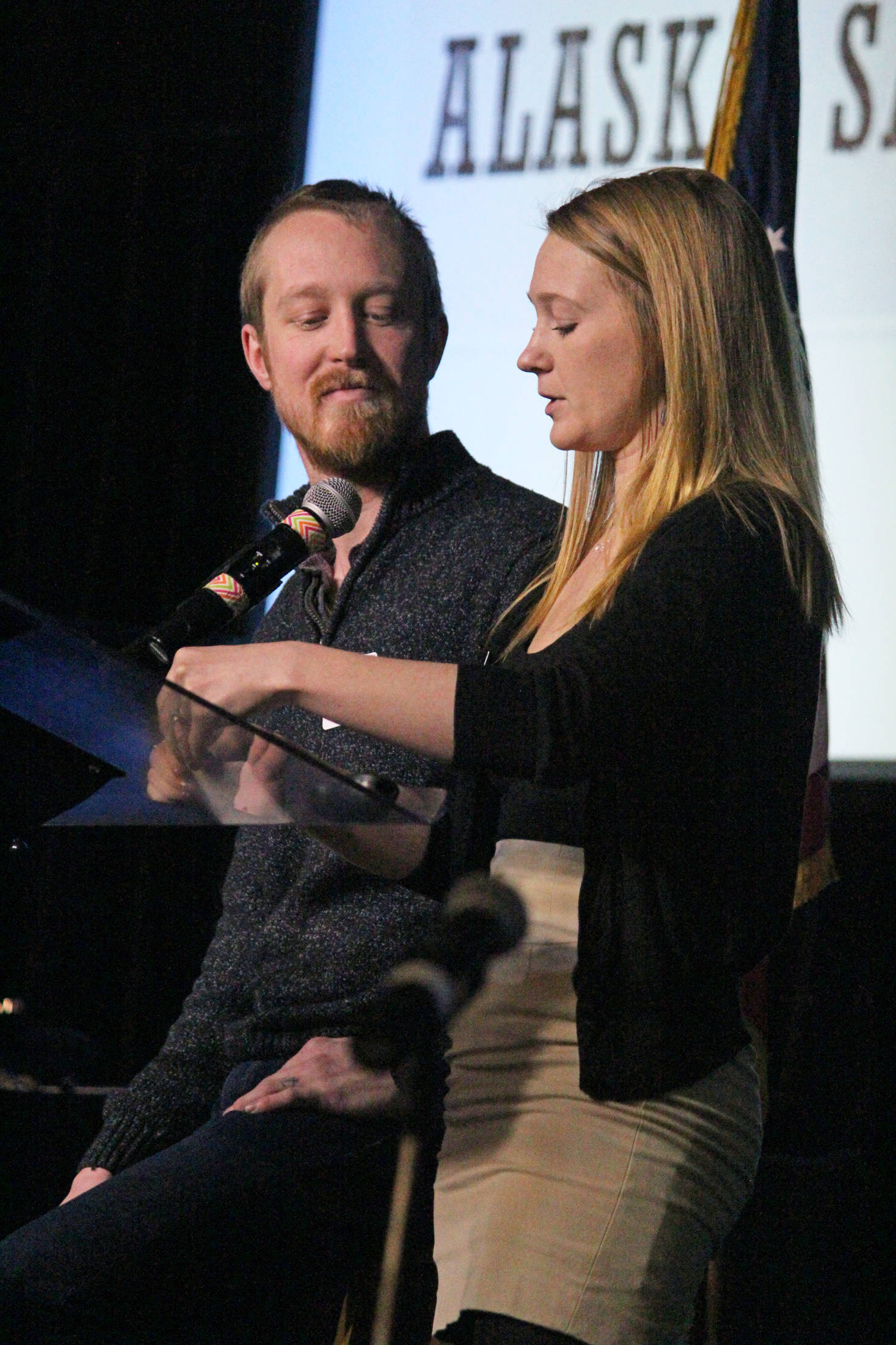 Casey (left) and Britni (right) Siekaniec, owners and operators of Alaska Salt Co., tell the story of their business during the annual Industry Outlook Forum on Wednesday, in Homer. (Photo by Megan Pacer/Homer News)