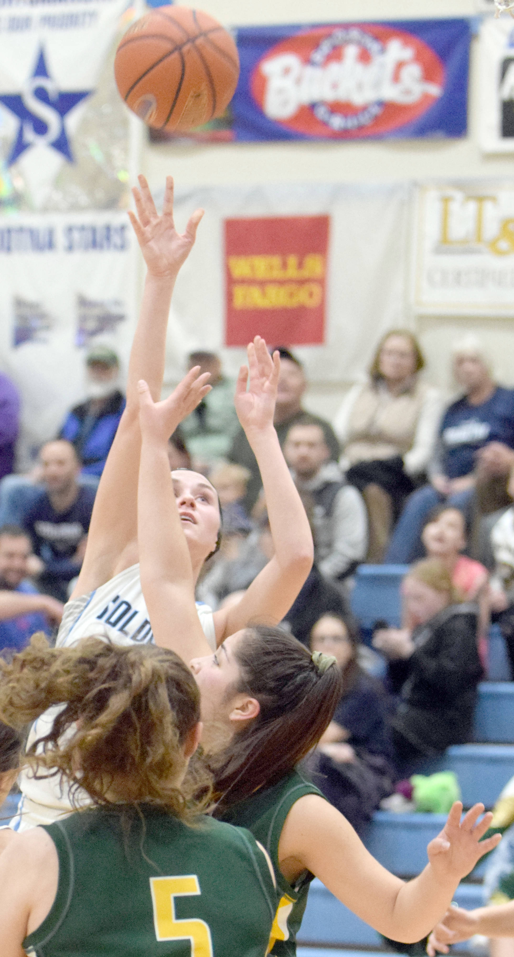 Soldotna’s Aliann Schmidt shoots over Seward’s Selma Casagranda on Friday at Soldotna High School. (Photo by Jeff Helminiak/Peninsula Clarion)