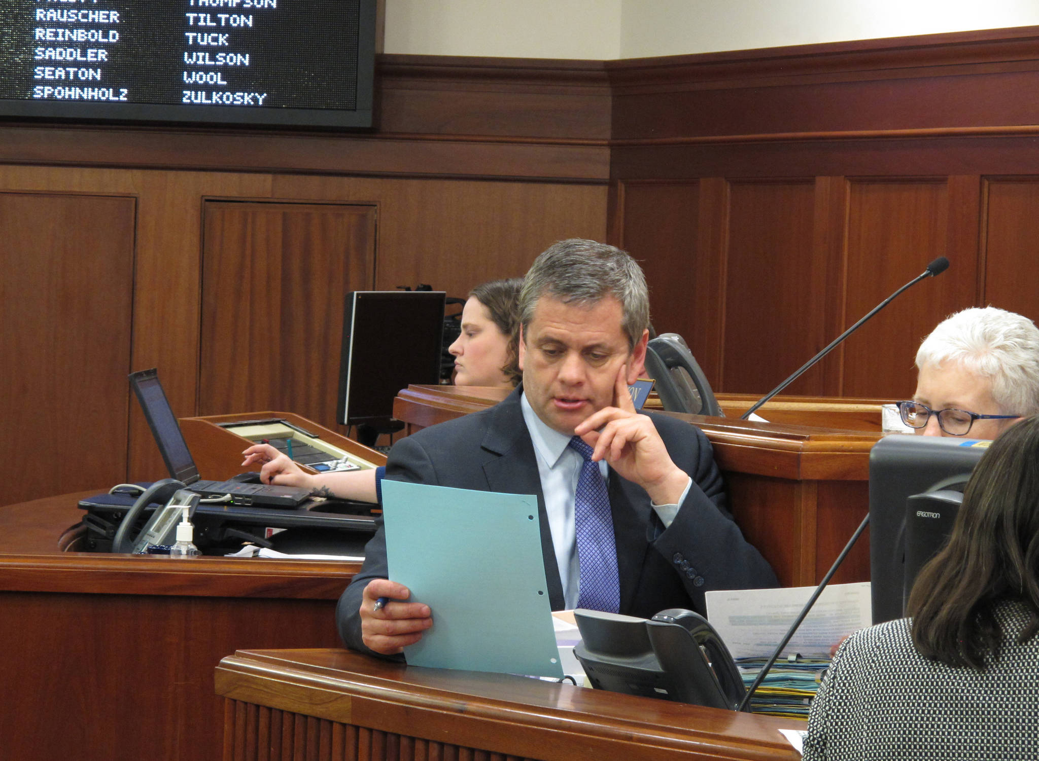 In this May 12, 2018, file photo, Alaska House Minority Leader Chris Tuck looks over a document during a break in the Alaska House floor session in Juneau. (AP Photo/Becky Bohrer, File)                                In this May 12, 2018 file photo, Alaska House Minority Leader Chris Tuck looks over a document during a break in the Alaska House floor session in Juneau, Alaska. (AP Photo/Becky Bohrer, File)