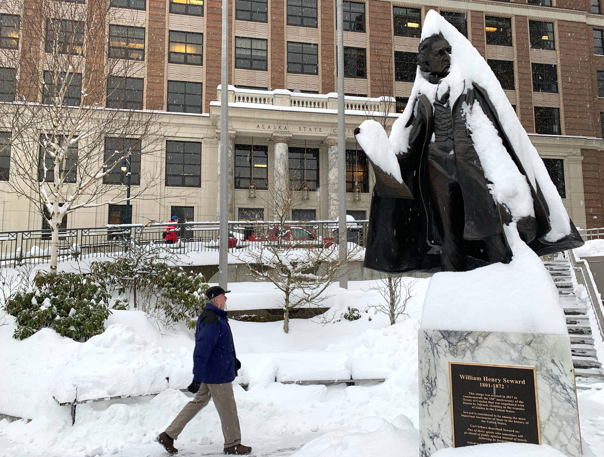 Snow coats the William Henry Seward statue outside of the Alaska State Capitol on Friday. (Angelo Saggiomo/Juneau Empire)