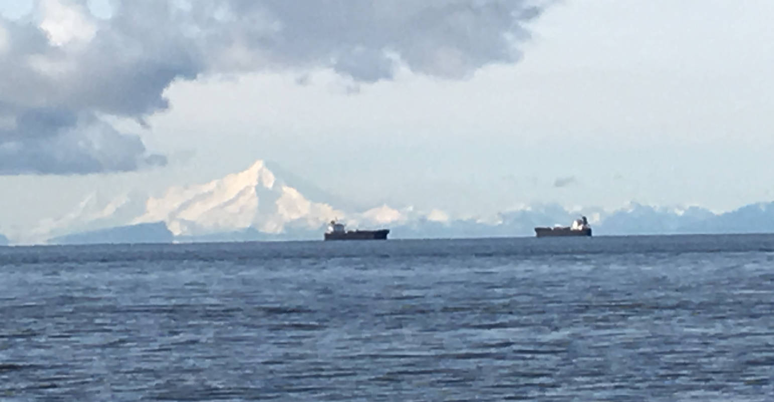 Two ships pass with Mount Iliamna in the background on Cook Inlet Sunday morning. (Photo by Will Morrow/Peninsula Clarion)                                Two ships pass with Mount Iliamna in the background on Cook Inlet Sunday morning. (Photo by Will Morrow/Peninsula Clarion)