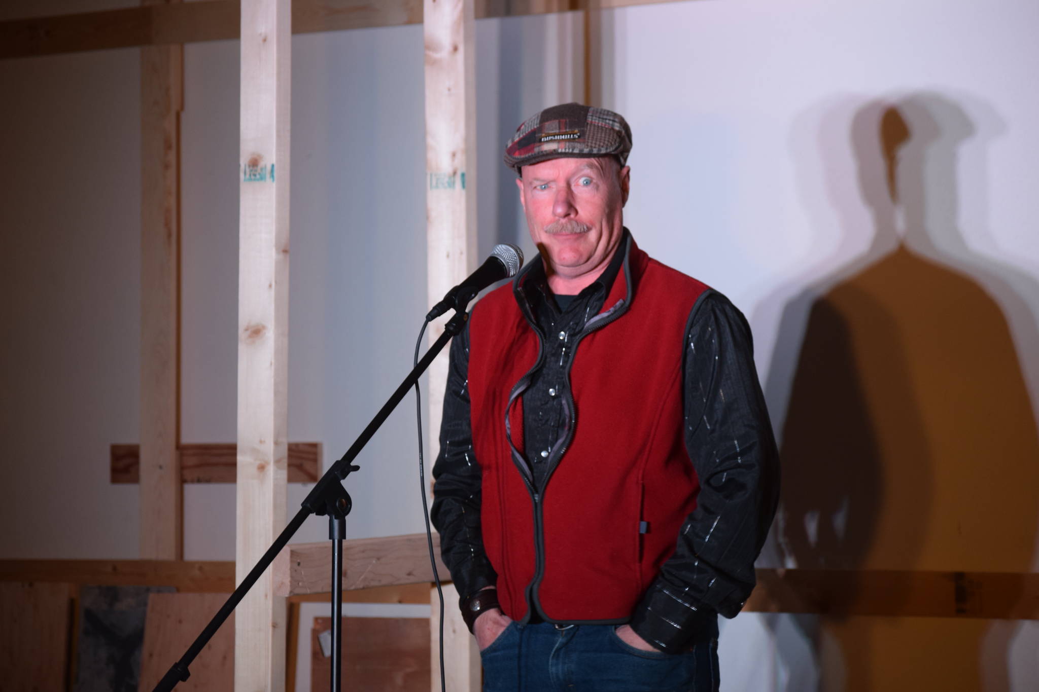 Kenai resident Paul Stevenson performs stand-up comedy for the first time at the Kenai Performers Theater on Thursday. (Photo by Brian Mazurek/Peninsula Clarion)
