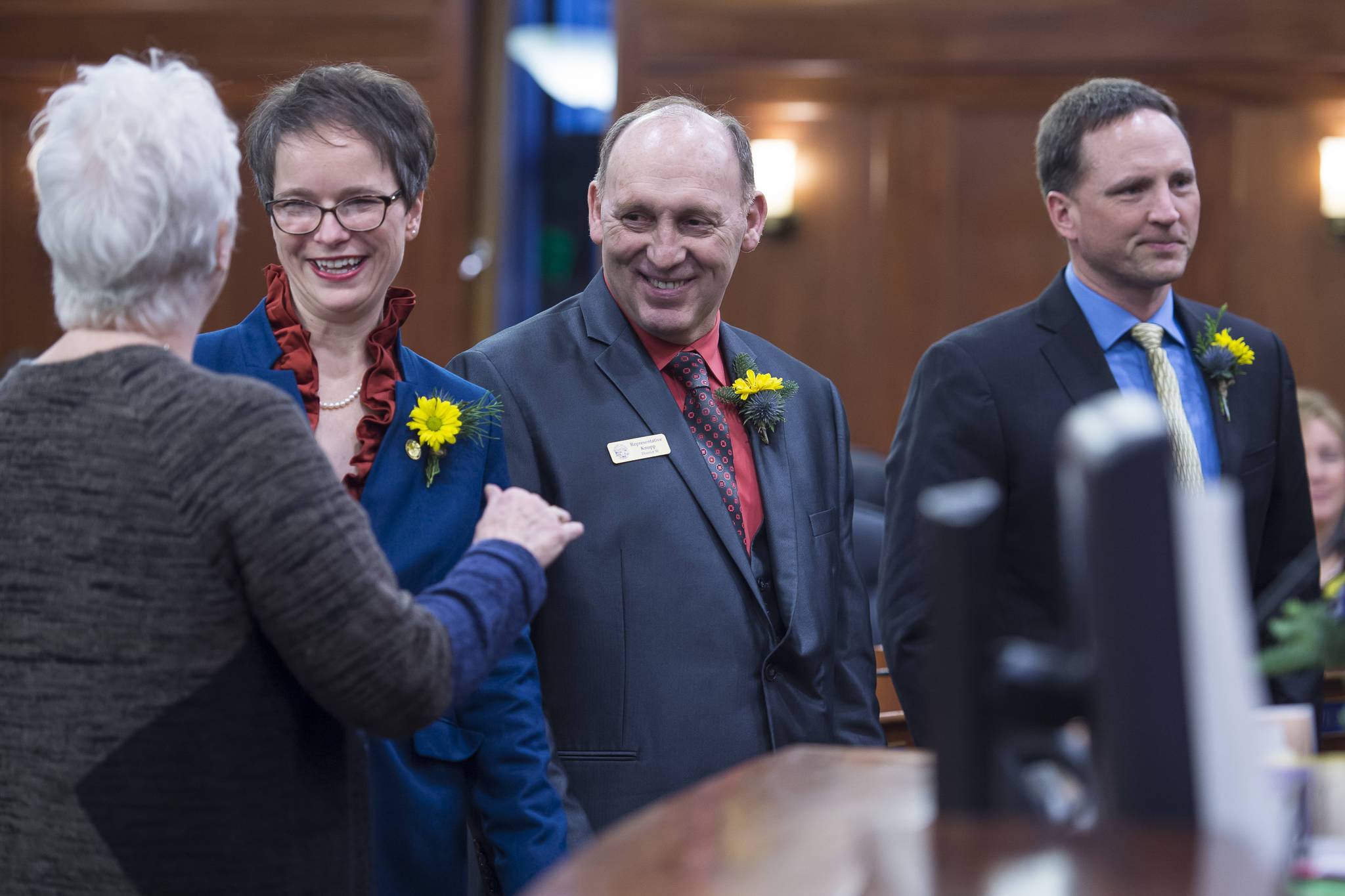 Rep. Louise Stutes, R-Kodiak, left, congratulates Rep. Sarah Vance, R-Homer, Rep. Gary Knopp, R-Kenai, and Rep. Ben Carpenter, R-Nikiski, right, after being sworn in on the opening day of the 31st Session of the Alaska Legislature on Tuesday. (Michael Penn | Juneau Empire)