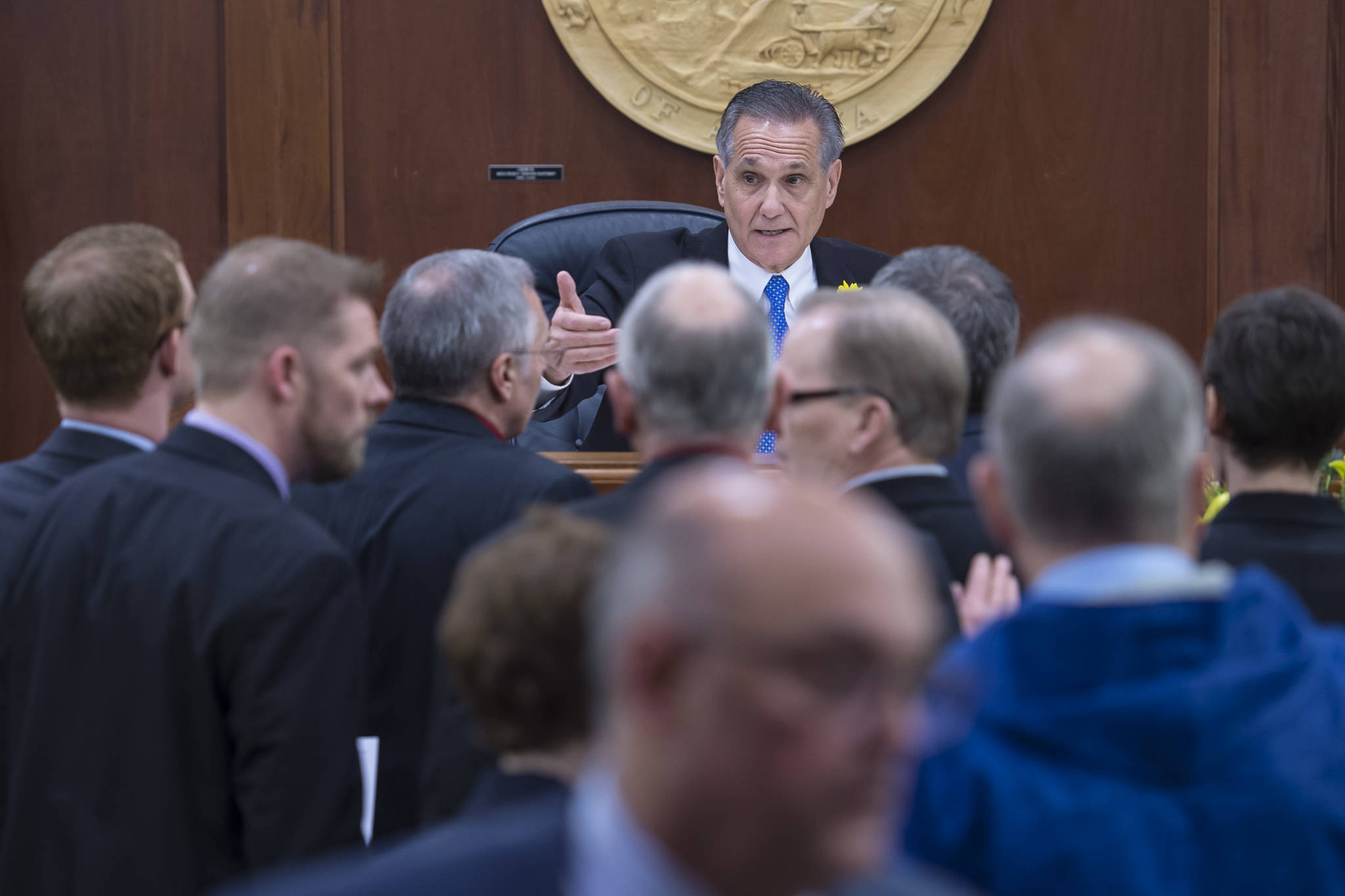 Republican Lt. Gov. Kevin Meyer, seated at the Speaker of the House chair, and Democratic legislators argue over what he can do on the first day of the 31st session of the Alaska Legislature on Tuesday, Jan. 15, 2019. (Michael Penn | Juneau Empire)