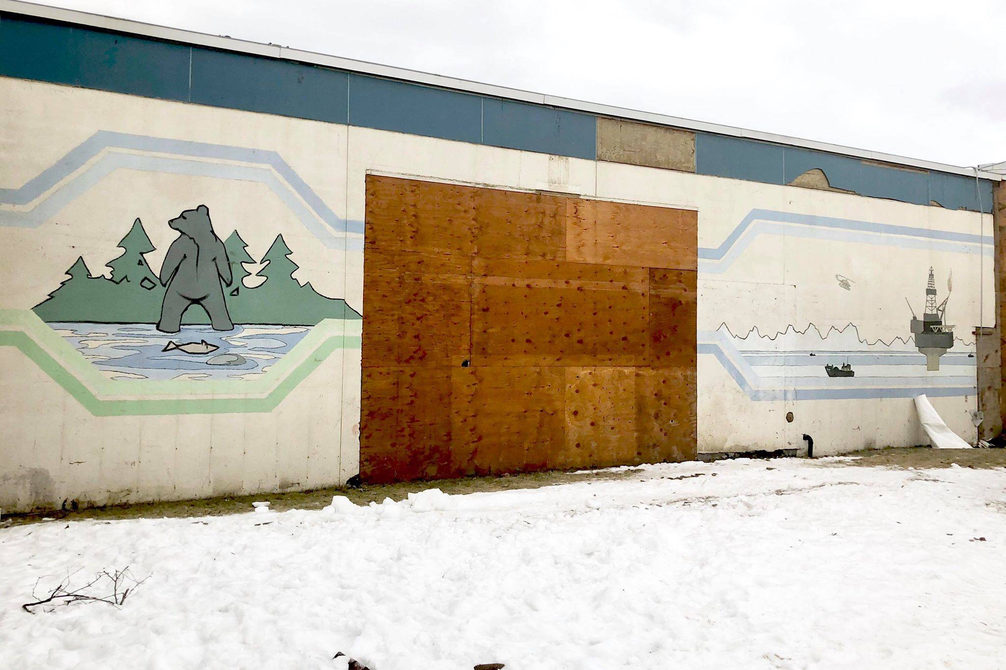More panels of the hidden mural were revealed Wednesday, as construction crews work on the remodel at the Kenai Municipal Airport. (Photo by Victoria Petersen/Peninsula Clarion)