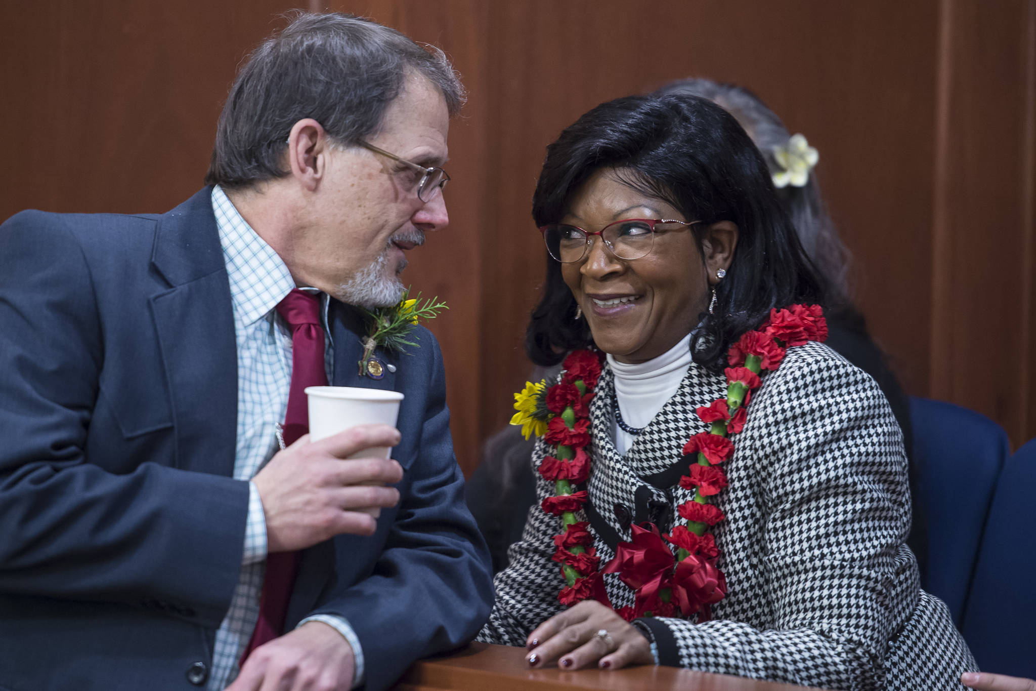 Rep. George Rauscher, R-Sutton, left, speaks with Sharon Jackson on the opening day of the 31st Session of the Alaska Legislature on Tuesday, Jan. 15, 2019. Jackson is Gov. Michael J. Dunleavy’s pick to replace Nancy Dahlstrom’s House District 13 seat for Chugiak. That position was left vacant in December after Dunleavy appointed Dahlstrom to be Department of Corrections commissioner. (Michael Penn | Juneau Empire)